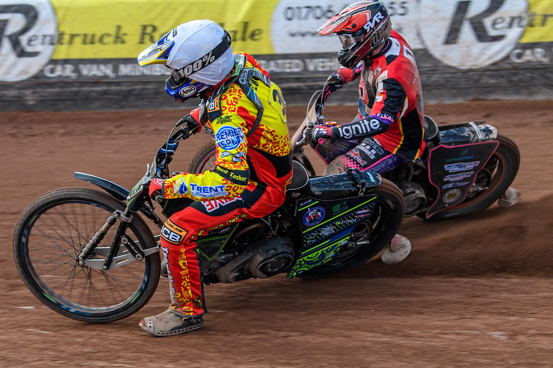 Leicester Lion Cubs' Tom Spencer (White) inside Belle Vue Colts' Ben Trigger  (Red) during the WSRA National Development League match between Belle Vue Colts and Leicester Lion Cubs at the National Speedway Stadium, Manchester on Friday 29th March 2024. (Photo: Ian Charles | MI News)