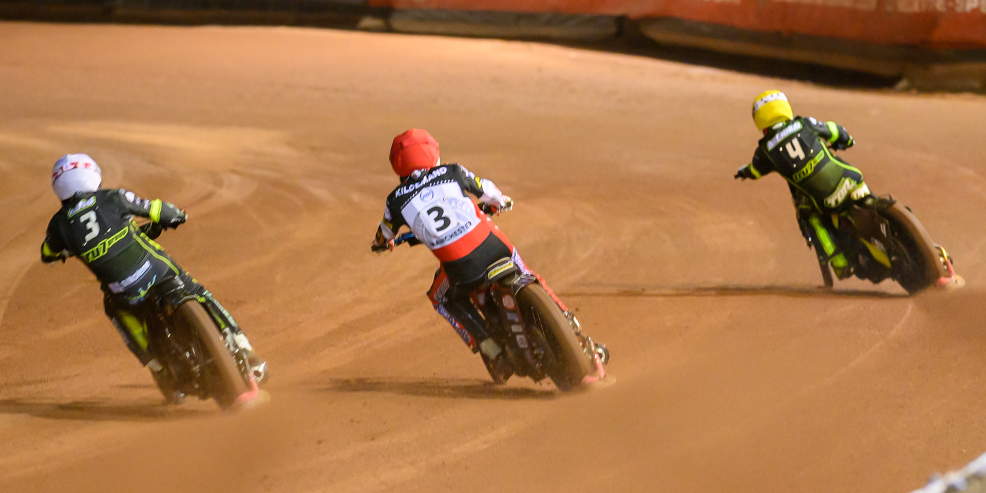 Peter Kildemand of Belle Vue Aces in Red \rides between Danny King of Ipswich Witches in White  and Tom Brennan of Ipswich Witches in Yellow during the Rowe Motor Oil Premiership Play Off Semi Final 2nd leg match between Belle Vue Aces and Ipswich Witches at the National Speedway Stadium, Manchester on Monday 28th September 2026. (Photo: Ian Charles | MI News)