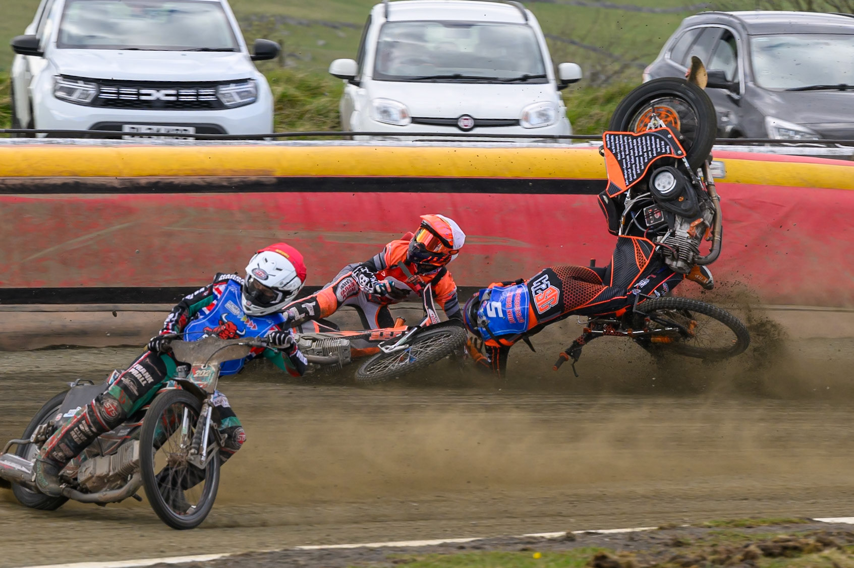 Connor Coles of NDL Nomads   in White fall and Jack Smith of Buxton Bulls   in Blue collides with him during the  Challenge match between Buxton Bulls and NDL Nomads at Hi-Edge Speedway, Buxton on Sunday 19th April 2026. (Photo: Ian Charles | MI News)