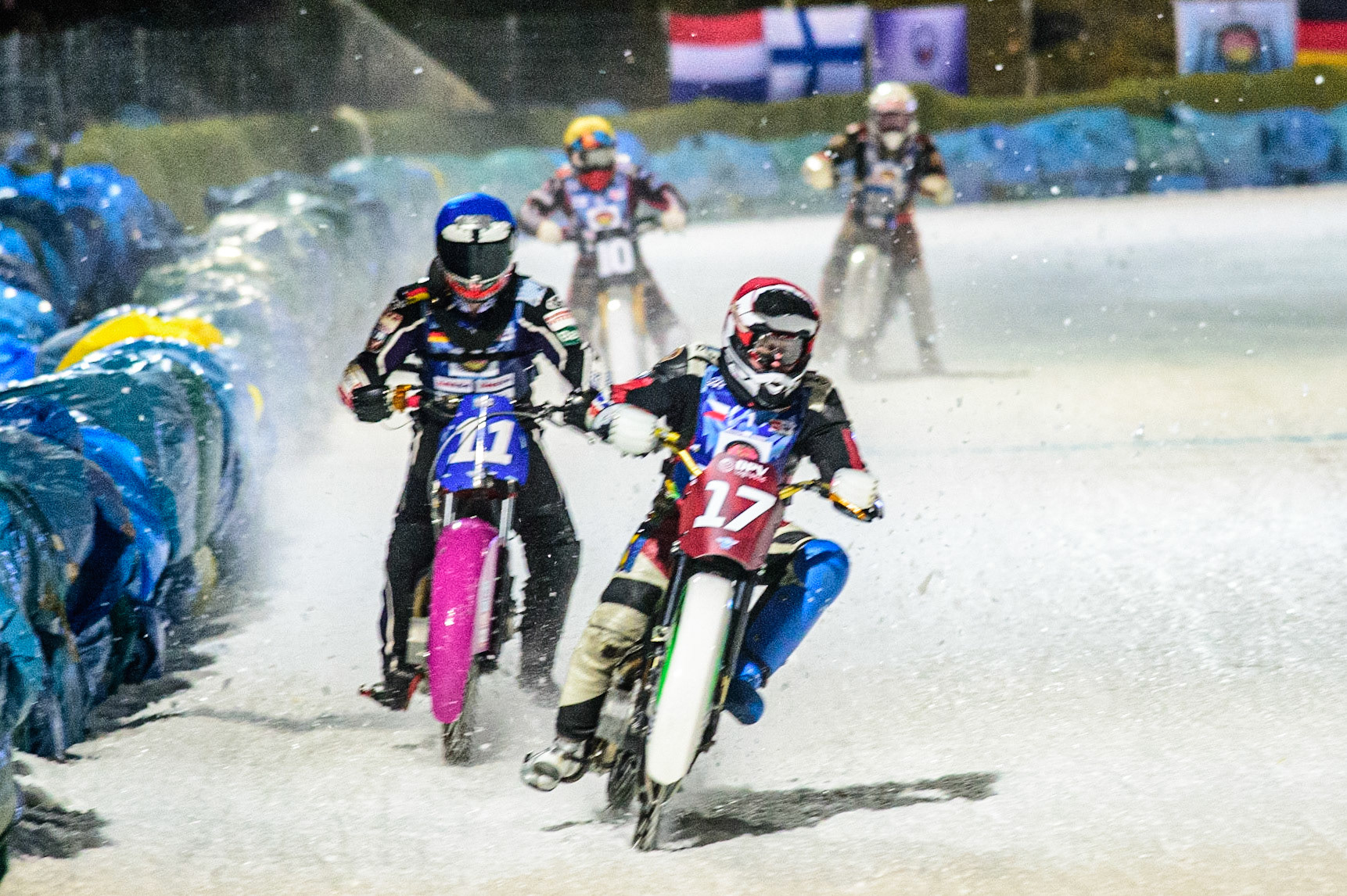 Andrej Divis (Red) leads  Benedikt Monn (Blue), Topi Mustonen (Yellow) and  Artturi Ervasti (White) during the German Individual Ice Speedway Championship at Horst-Dohm-Eisstadion, Berlin on Friday 3rd March 2023. (Photo: Ian Charles | MI News)