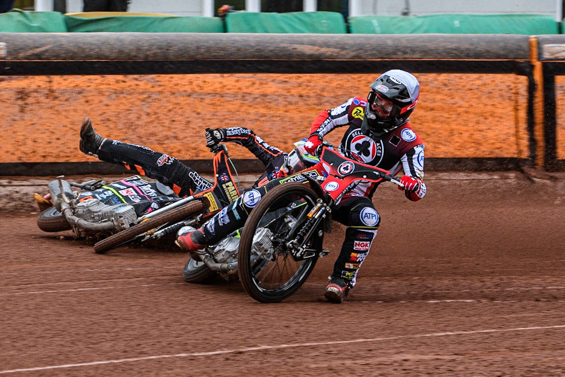 Tom Brennan (White) inside Leon Flint (Blue) as he falls in the first bend during the Sports Insure Premiership match between Wolverhampton Wolves and Belle Vue Aces at Monmore Green Stadium, Wolverhampton on Monday 10th July 2023. (Photo: Ian Charles | MI News)