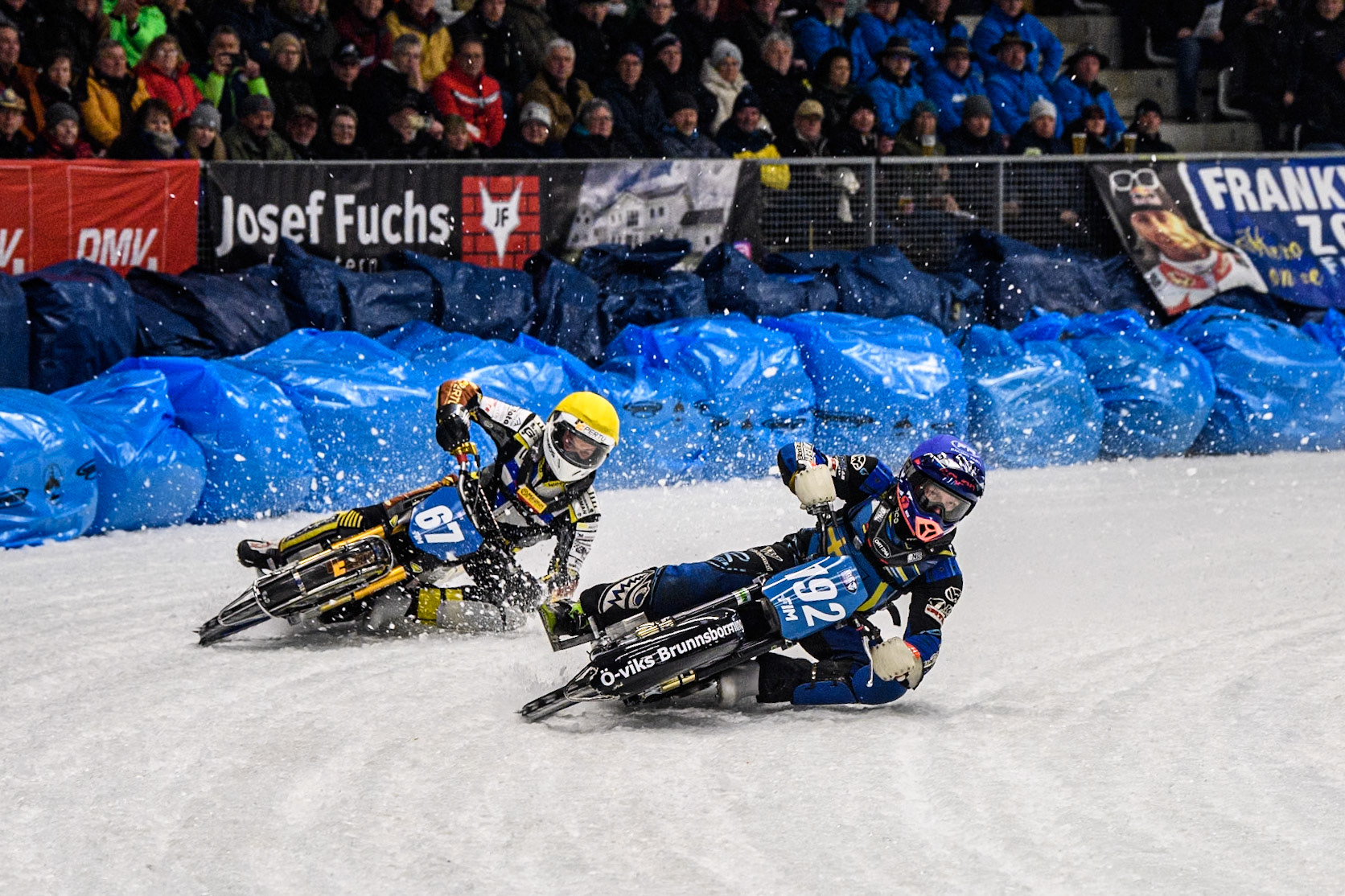 Niclas Svensson (192) of Sweden in Blue leading Heikki Huusko (67) of Finland in Yellow during the Ice Speedway Gladiators World Championship Final 2 at Max-Aicher-Arena, Inzell on Sunday 16th March 2025. (Photo: Ian Charles | MI News)
