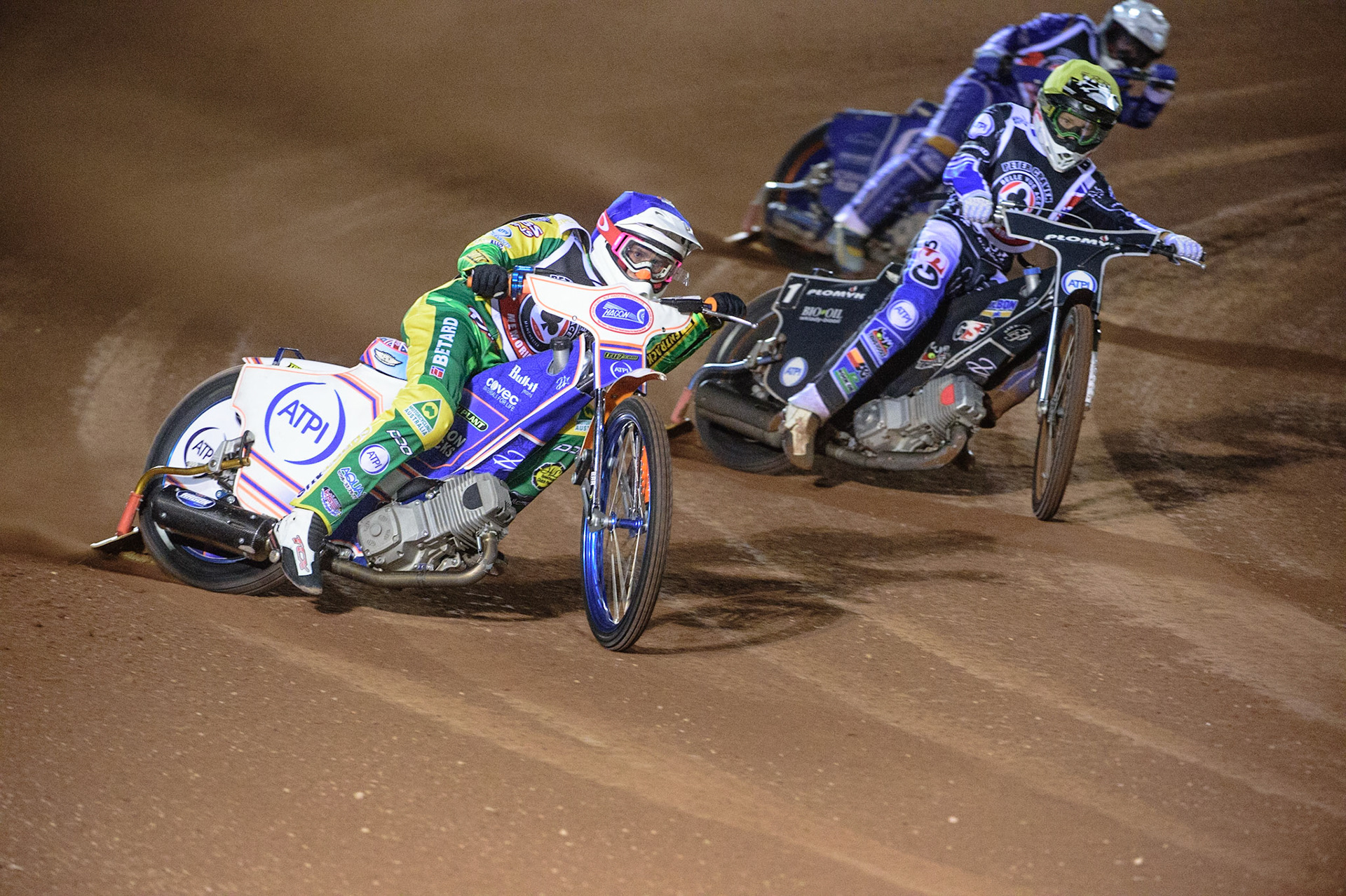 MANCHESTER, UK. OCT 23RD  Max Fricke  (Blue) leads Dan Bewley  (Yellow) and Kyle Howarth  (White) during the Peter Craven Memorial Trophy event at the National Speedway Stadium, Manchester on Saturday 23rd October 2021. (Credit: Ian Charles | MI News)