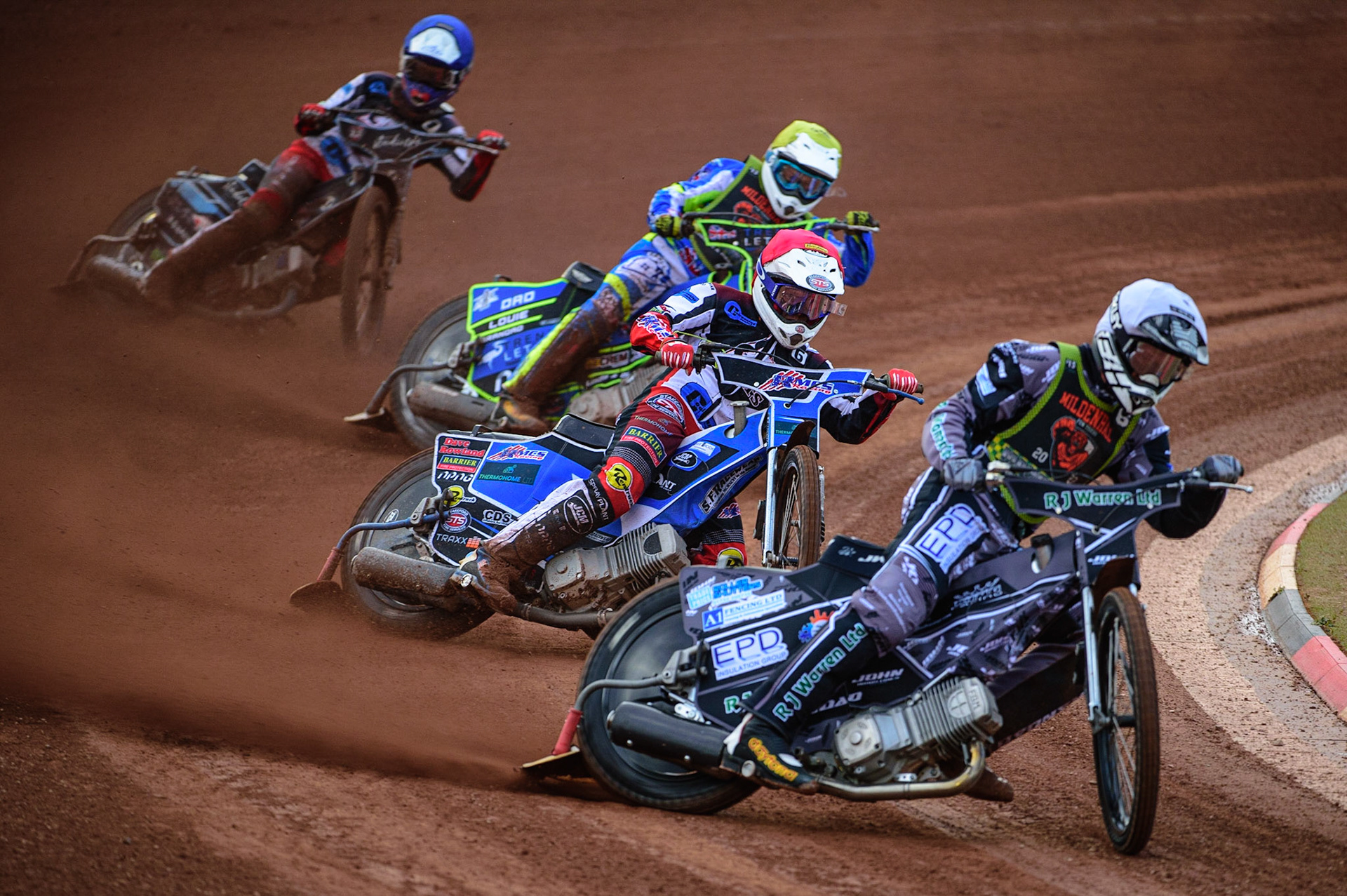 Josh Warren  (White) leads Archie Freeman  (Red) Luke Muff  (Yellow) and Freddy Hodder  (Blue) during the National Development League match between Belle Vue Colts and Mildenhall Fens Tigers at the National Speedway Stadium, Manchester on Friday 15th July 2022. (Credit: Ian Charles | MI News)