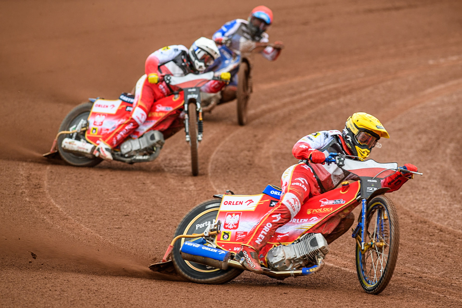 Bartosz Zmarzlik of Poland in Yellow leading Dominik Kubera of Poland in White and David Bellego of France in Red during the Monster Energy FIM Speedway of Nations Semi-Final 1 at the National Speedway Stadium, Manchester on Tuesday 9th July 2024. (Photo: Ian Charles | MI News)