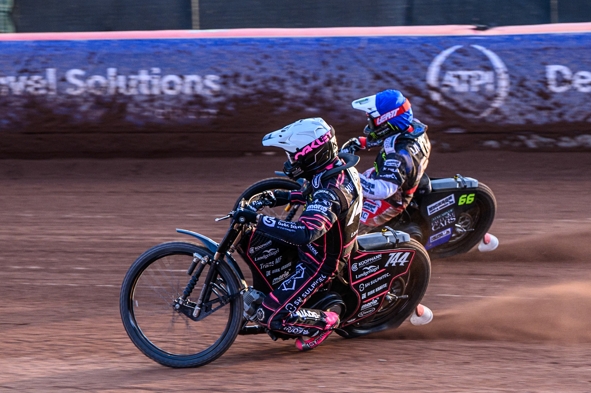 Kai Huckenbeck (744) of Germany in White on the inside  of Fredrik Lindgren (66) of Sweden in Blue during the ATPI FIM Speedway Grand Prix Round 5 at the National Speedway Stadium, Manchester, on Saturday 14th June 2025. (Photo: Ian Charles | MI News)