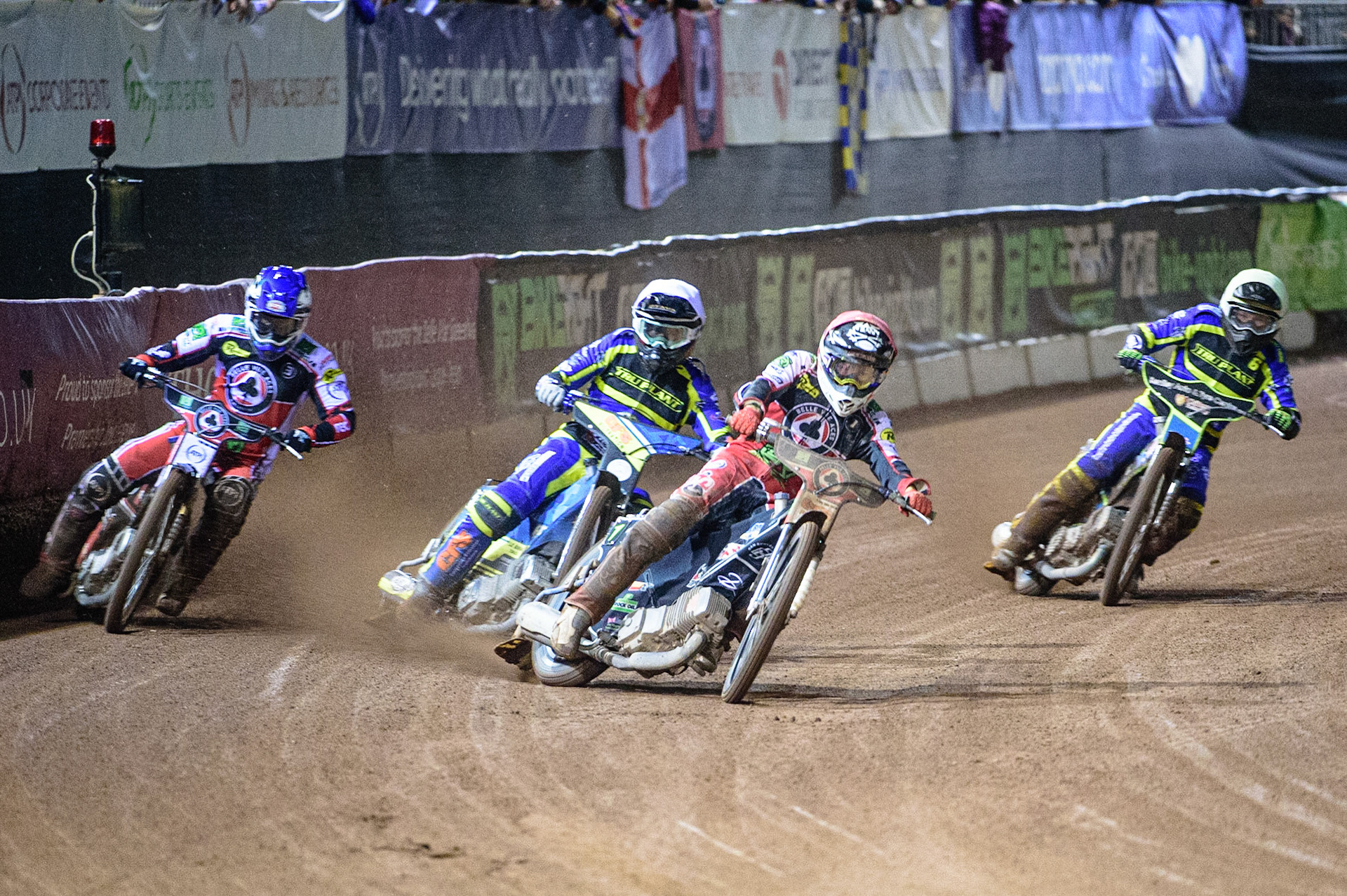 MANCHESTER, UK. OCT 7TH  Dan Bewley  (Red) leads Richie Worrall  (Blue) Adam Ellis  (White) and Danyon Hume  (Yellow) during the SGB Premiership Play off Semi-Final Second Leg between Belle Vue Aces and Sheffield Tigers at the National Speedway Stadium, Manchester on Thursday 7th October 2021. (Credit: Ian Charles | MI News)
