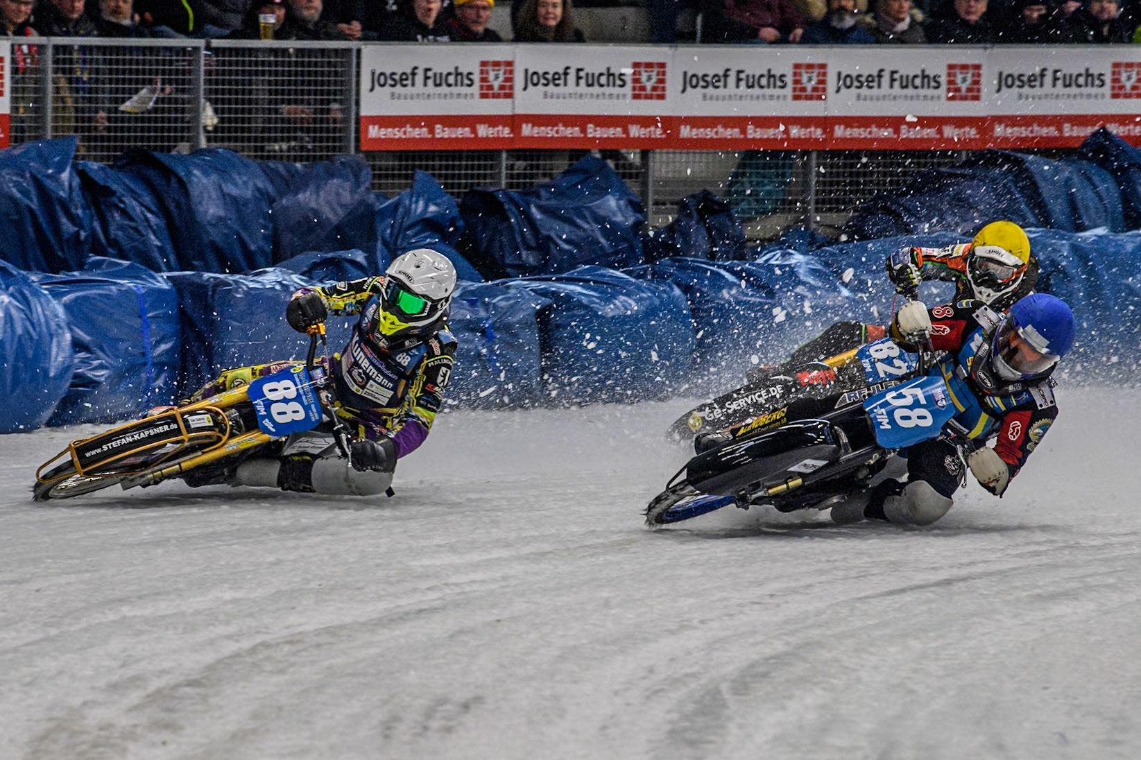 Sweden's Stefan Svensson (58) (Blue) leads  Germany's Max Niedermaier (88) (White) and Germany's Markus Jell (82) (Yellow) during the FIM Ice Speedway Gladiators World Championship Final 2 at the Max-Aicher-Arena, Inzell on Sunday 24 March 2024. (Photo: Ian Charles | MI News)