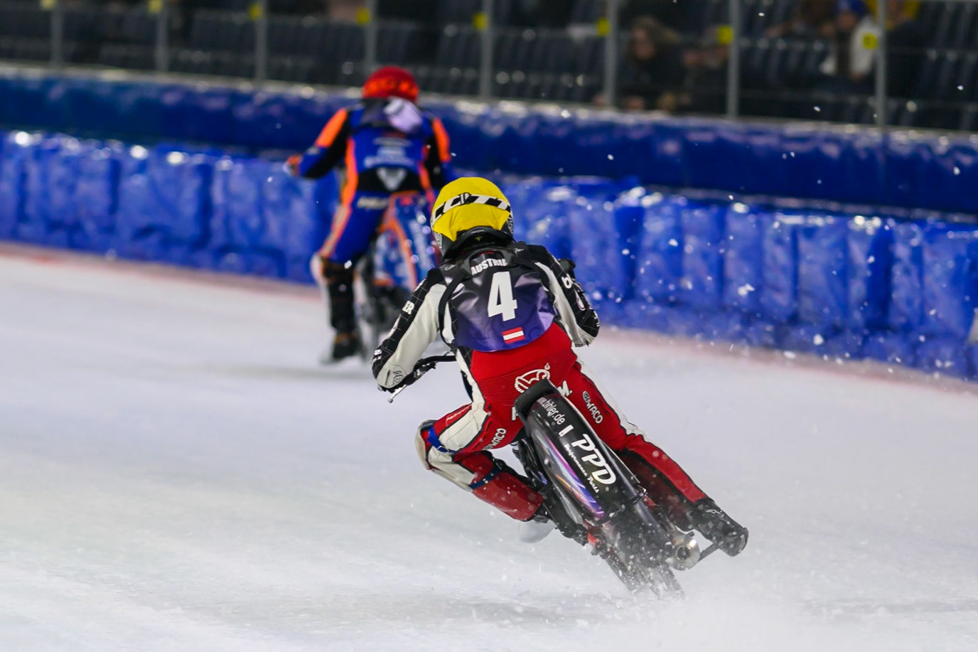 Martin Posch (4) of Austria  in Yellow chases Lukáš Hutla (7) of Czechia  in Red during the FIM Ice Speedway Of Nations at Ice Rink Thialf, Heerenveen on Sunday 12th April 2026. (Photo: Ian Charles | MI News)