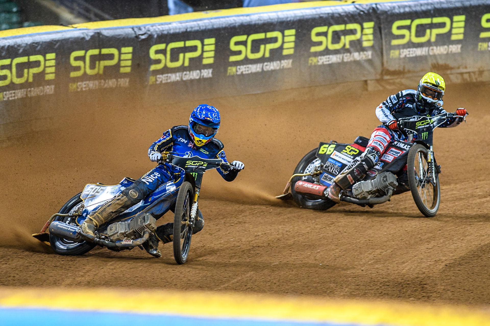 Robert Lambert (505) of Great Britain in Blue leading Fredrik Lindgren (66) of Sweden in Yellow during the FIM Speedway Grand Prix of Great Britain at The Principality Stadium, Cardiff on Saturday 17th August 2024. (Photo: Ian Charles | MI News)