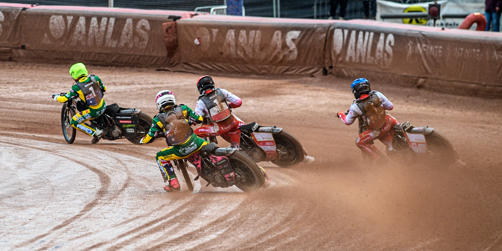 James Pearson of Australia in White chases Wiktor Przyjemski of Poland in Red Bartosz Banbor of Poland in Blue and Keynan Rew of Australia in Yellow during the Monster Energy FIM Speedway of Nations 2 (Under 21) Final at the National Speedway Stadium, Manchester on Friday 12th July 2024. (Photo: Ian Charles | MI News)