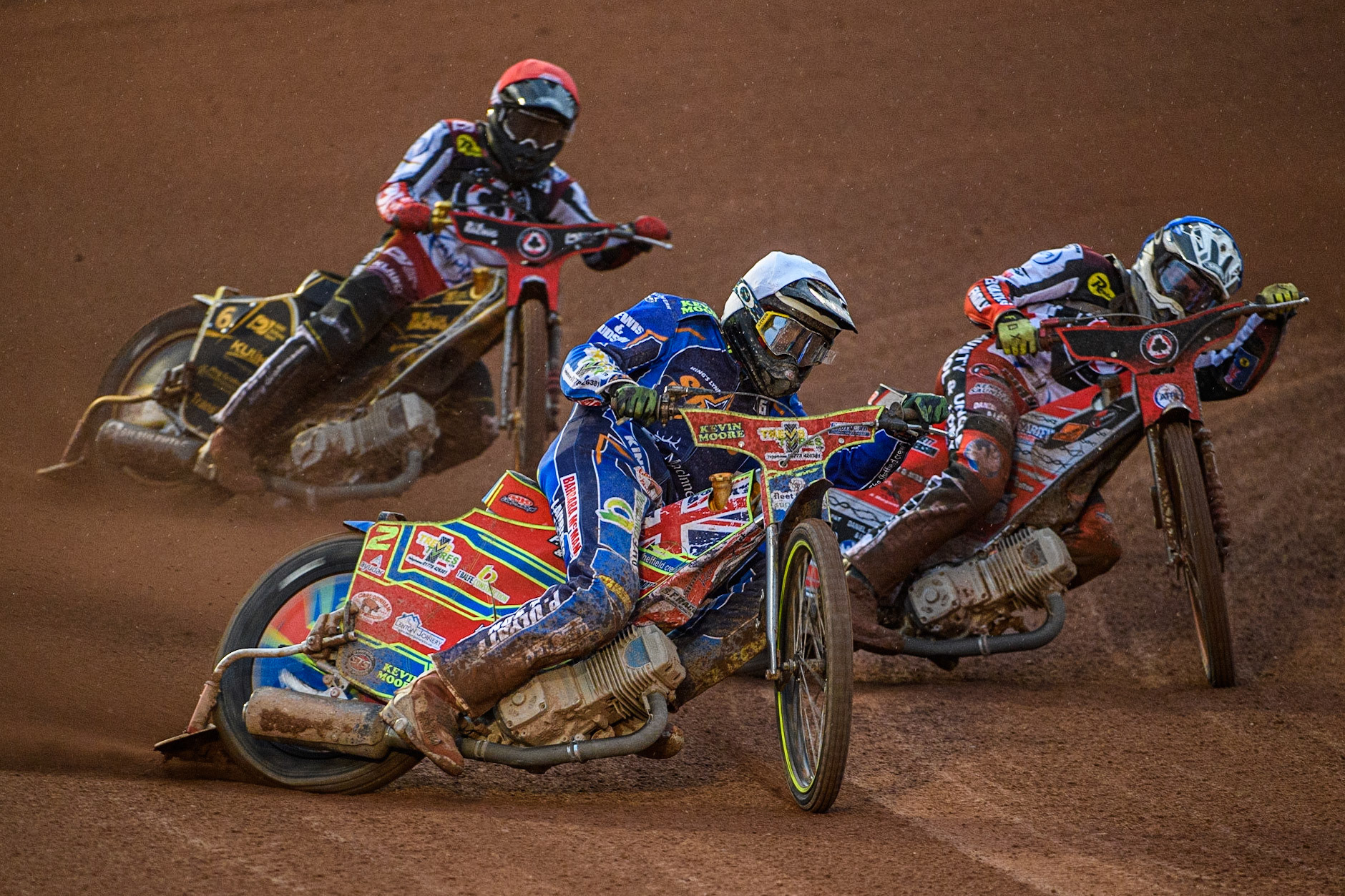 Simon Lambert (White) outside Connor Bailey (Blue) with Norick Blodorn (Red) behind during the Sports Insure Premiership match between Belle Vue Aces and King's Lynn Stars at the National Speedway Stadium, Manchester on Monday 21st August 2023. (Photo: Ian Charles | MI News)