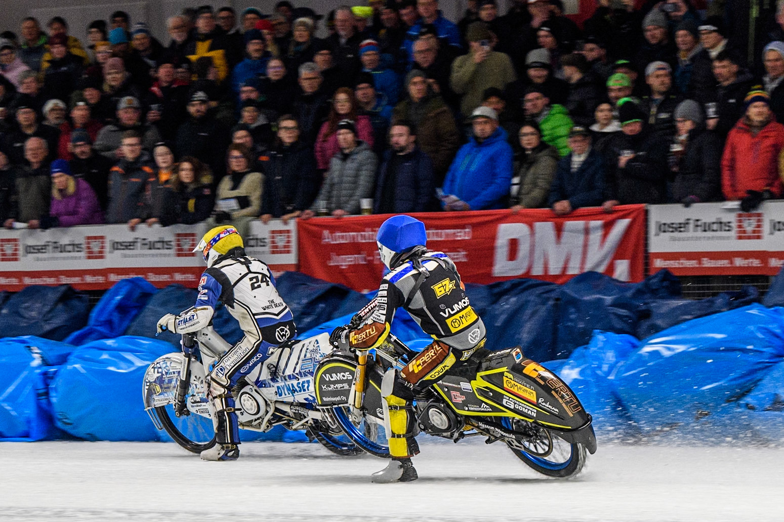 Heikki Huusko (67) of Finland in Blue chases Max Koivula (24) of Finland in Yellow during the Ice Speedway Gladiators World Championship Final 1 at Max-Aicher-Arena, Inzell on Saturday 15th March 2025. (Photo: Ian Charles | MI News)