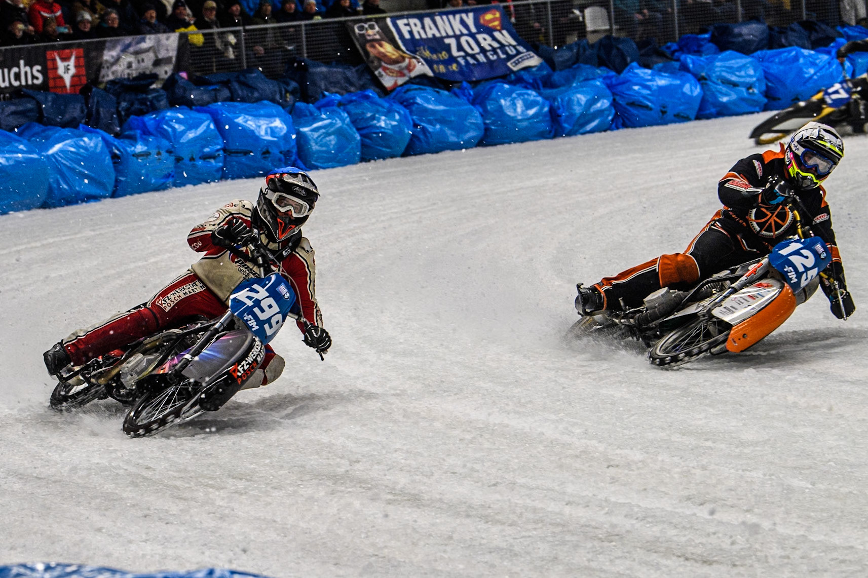 Sebastian Reitsma (125) of The Netherlands in White rides inside Martin Posch (299) of Austria in Blue during the Ice Speedway Gladiators World Championship Final 2 at Max-Aicher-Arena, Inzell on Sunday 16th March 2025. (Photo: Ian Charles | MI News)