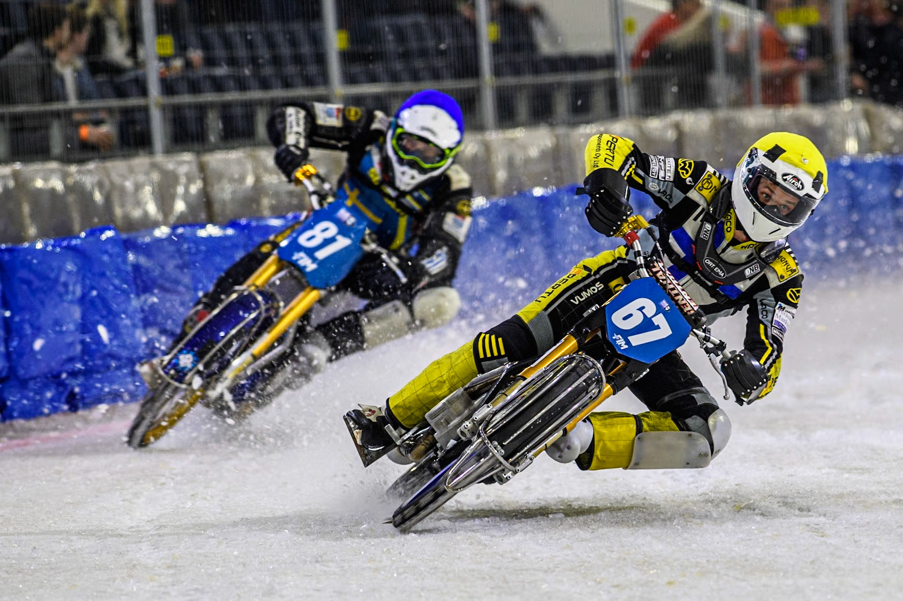 Finland's Heikki Huusko (67) in Yellow leading Sweden"s Jimmy Olsén (81) in White during the FIM Ice Speedway Gladiators World Championship Final 3 at Ice Rink Thialf, Heerenveen on Saturday 6th April 2024. (Photo: Ian Charles | MI News)
