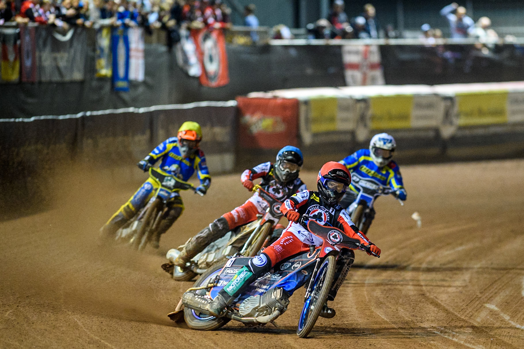 Belle Vue Aces' Brady Kurtz  in Red leading Belle Vue Aces' Norick Blodorn  in Blue, Sheffield Tigers' Guest Rider Chris Harris  in White and Sheffield Tigers' Jason Edwards  in Yellow during the Rowe Motor Oil Premiership Play Off Semi Final 2, 1st Leg match between Belle Vue Aces and Sheffield Tigers at the National Speedway Stadium, Manchester on Monday 16th September 2024. (Photo: Ian Charles | MI News)