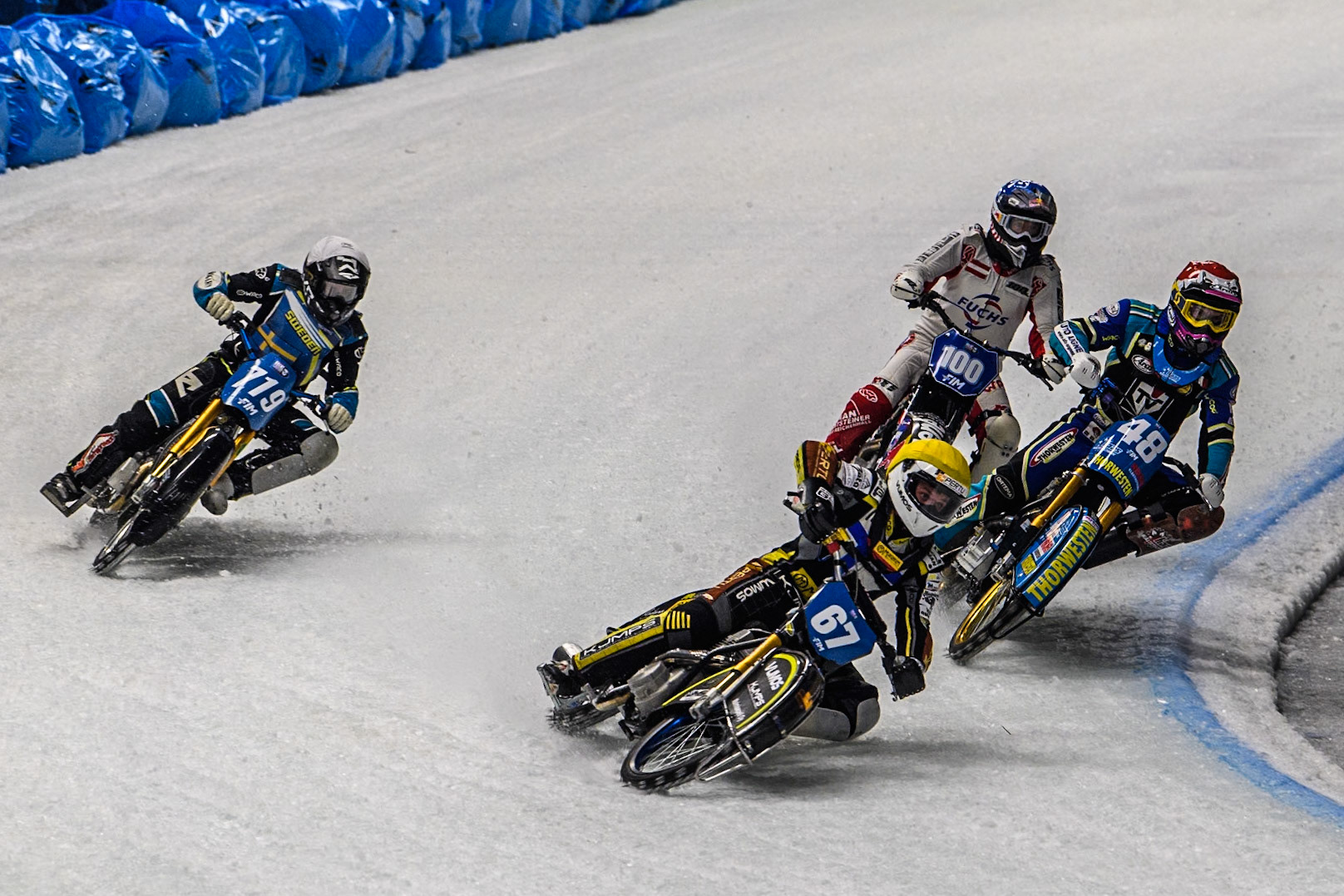 Heikki Huusko (67) of Finland in Yellow leading Luca Bauer (48) of Germany in Red Filip Jäger (719) of Sweden in White and Franky Zorn (100) of Austria in Blue during the Ice Speedway Gladiators World Championship Final 1 at Max-Aicher-Arena, Inzell on Saturday 15th March 2025. (Photo: Ian Charles | MI News)