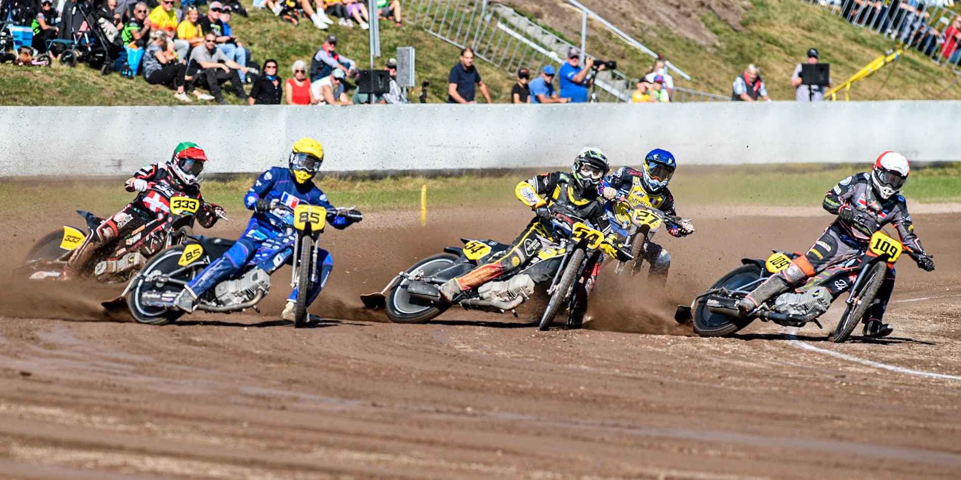 Zach Wajtknecht (109) of Great Britain in Red rides inside \Mika Meijer (54) of The Netherlands in White and Jordan Dubernard (85) of France in Yellow with 27\ in Blue and Kenneth Kruse Hansen (333) of Denmark in Green  behind during the FIM Long Track World Championship Final 5 at the Speed Centre Roden, Roden, Netherlands on Sunday 22nd September 2024. (Photo: Ian Charles | MI News)