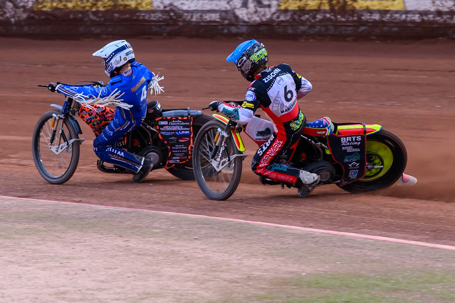 Tate Zischke of Belle Vue Aces in Blue chases Cooper Rushen of Kings Lynn Stars in White during the Rowe Motor Oil Premiership match between Belle Vue Aces and King's Lynn Stars at the National Speedway Stadium, Manchester on Monday 29th June 2026. (Photo: Ian Charles | MI News)