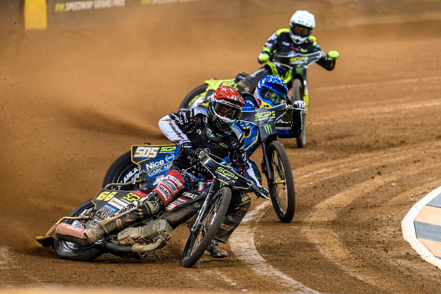 Fredrik Lindgren (66) of Sweden in Red leading Robert Lambert (505) of Great Britain in Blue and Martin Vaculik (54) of Slovakia in White  in Semi Final 1 during the FIM Speedway Grand Prix of Great Britain at The Principality Stadium, Cardiff on Saturday 17th August 2024. (Photo: Ian Charles | MI News)