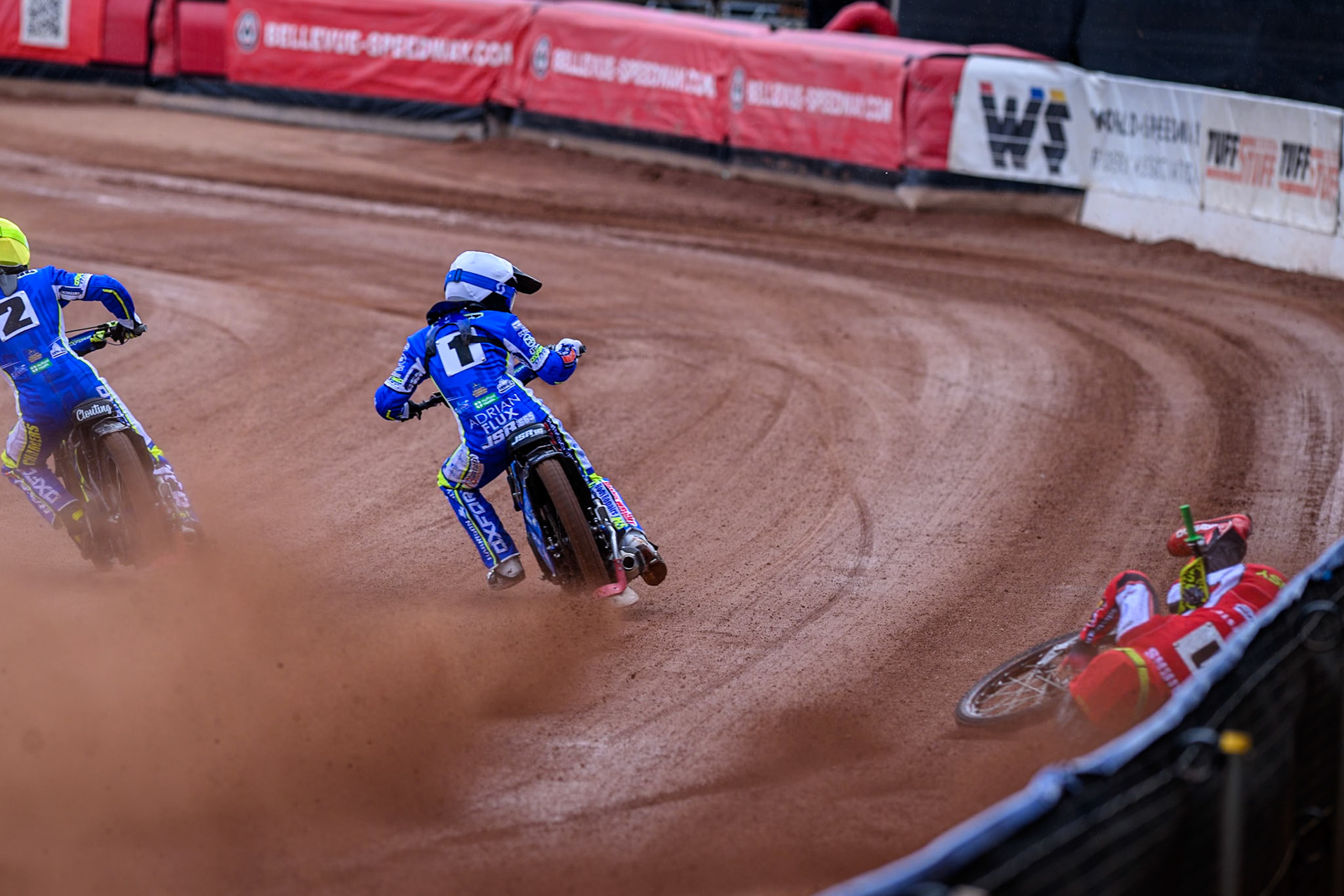Belle Vue Colts' William Cairns falls whilst trying to pass Oxford Chargers' Jody Scott  in White and Oxford Chargers' Jacob Clouting  in Yellow during the WSRA National Development League match between Belle Vue Colts and Oxford Chargers at the National Speedway Stadium, Manchester on Sunday 1st June 2025. (Photo: Ian Charles | MI News)