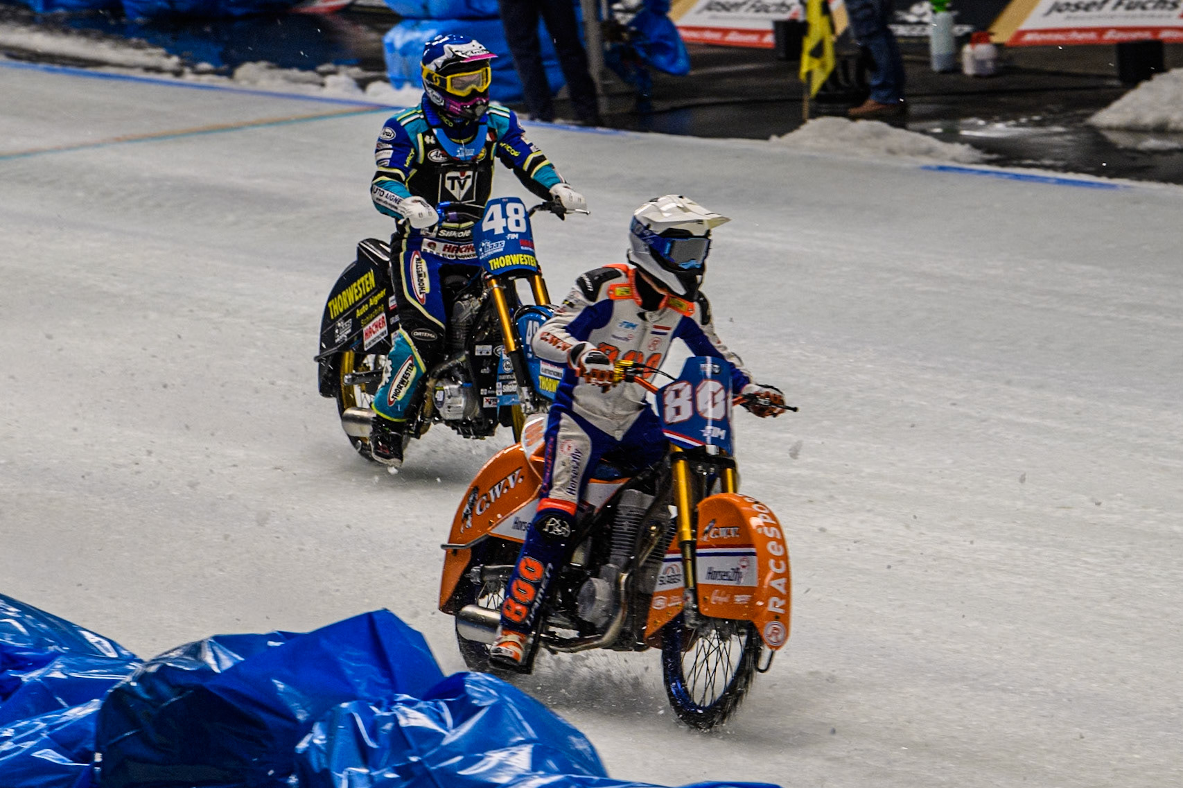 Jasper Iwema (800) of The Netherlands in White leading Luca Bauer (48) of Germany in Blue during the Ice Speedway Gladiators World Championship Final 2 at Max-Aicher-Arena, Inzell on Sunday 16th March 2025. (Photo: Ian Charles | MI News)