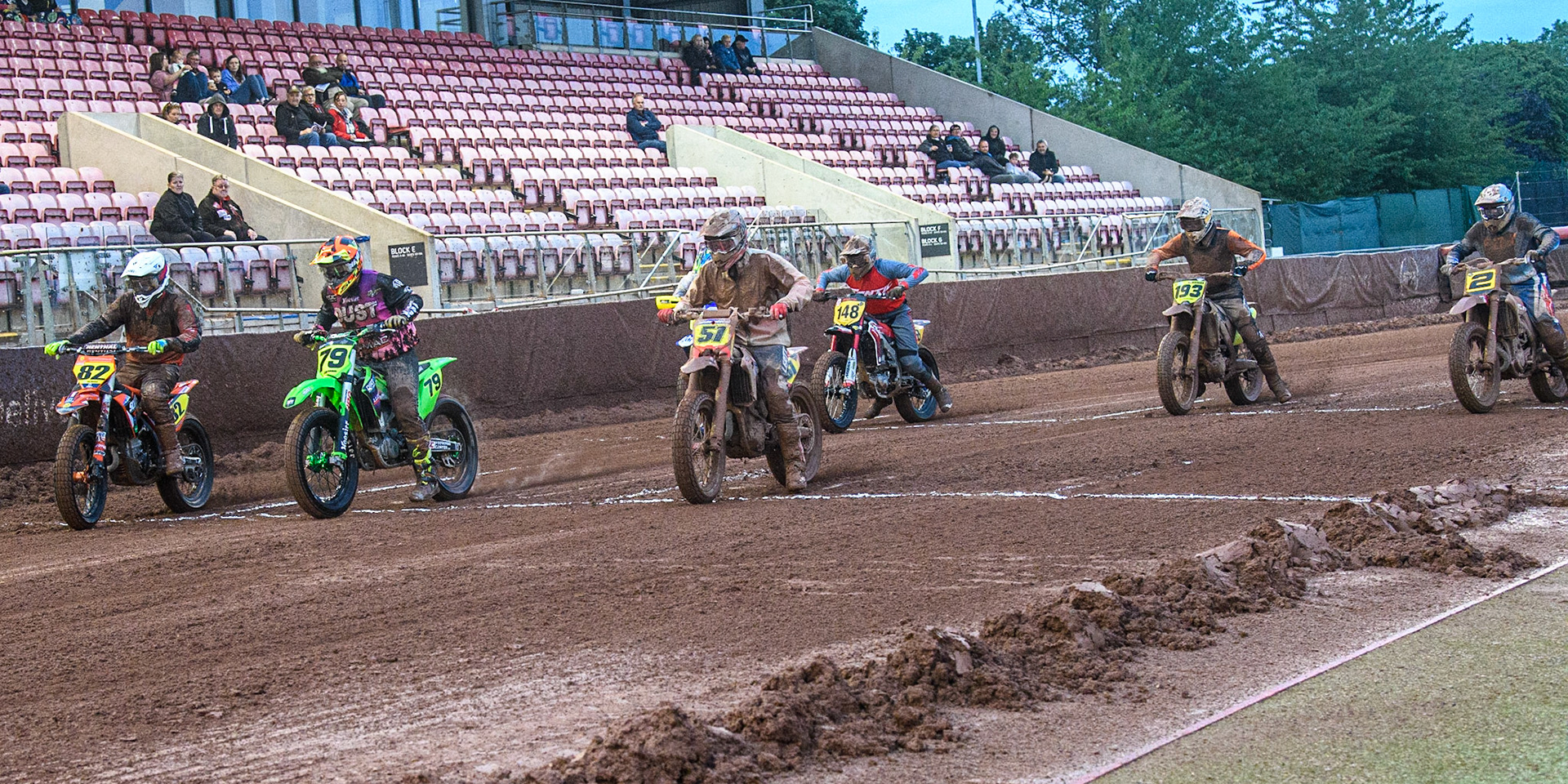 (l - r) Markus Jell (82) from Germany Josep Piedra (79) from Spain and Florian Eder (51) from Austria lead from the start during the FIM World Flat Track Championship Round 1 at the National Speedway Stadium, Manchester on Saturday 5th August 2023. (Photo: Ian Charles | MI News)