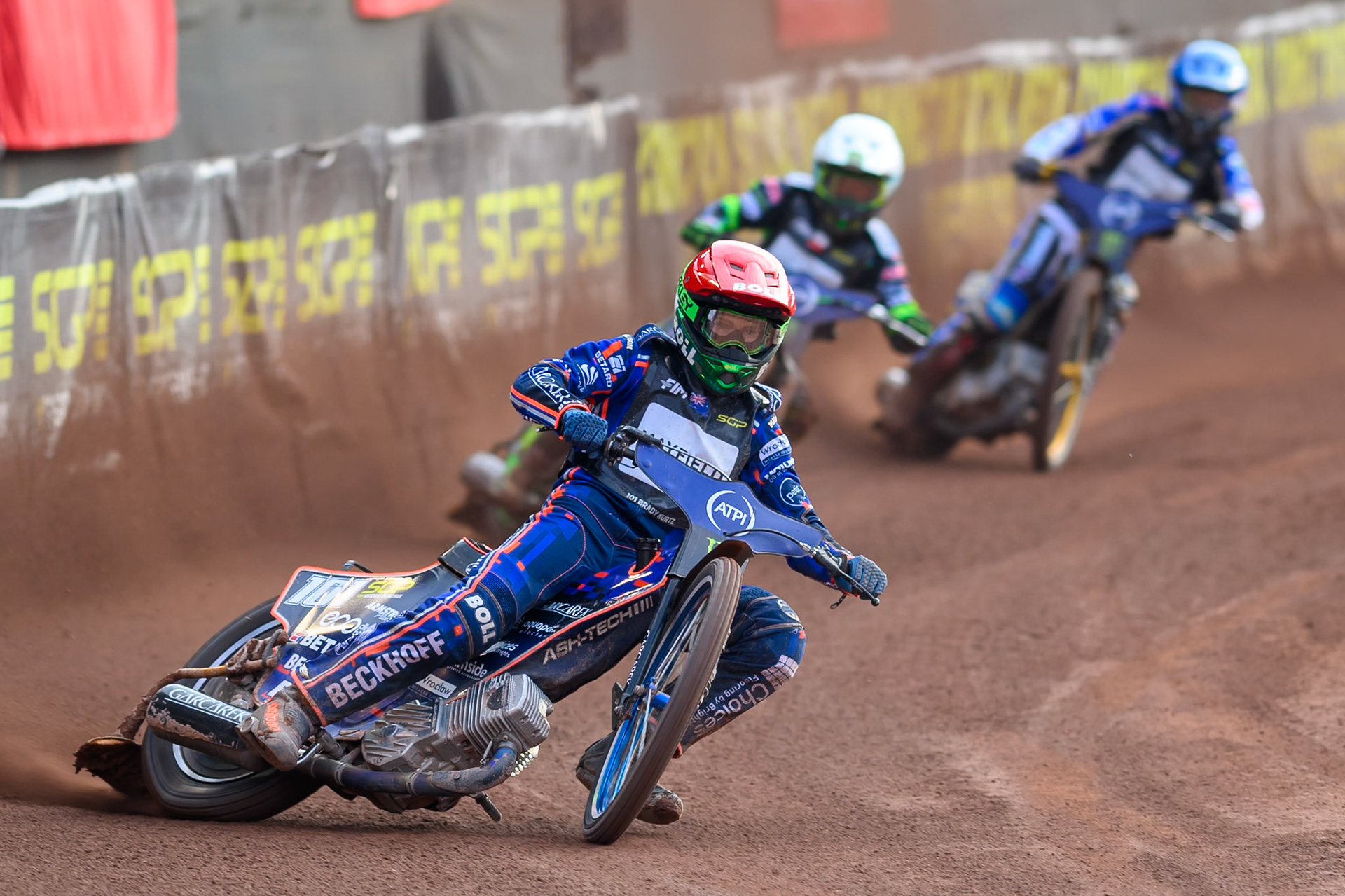Brady Kurtz (101) of Australia in Red leading Patryk Dudek (692) of Poland in White and Jason Doyle (69) of Australia in Blue during the ATPI  FIM Speedway GP of Manchester at the National Speedway Stadium, Manchester on Friday 5th June 2026. (Photo: Ian Charles | MI News)