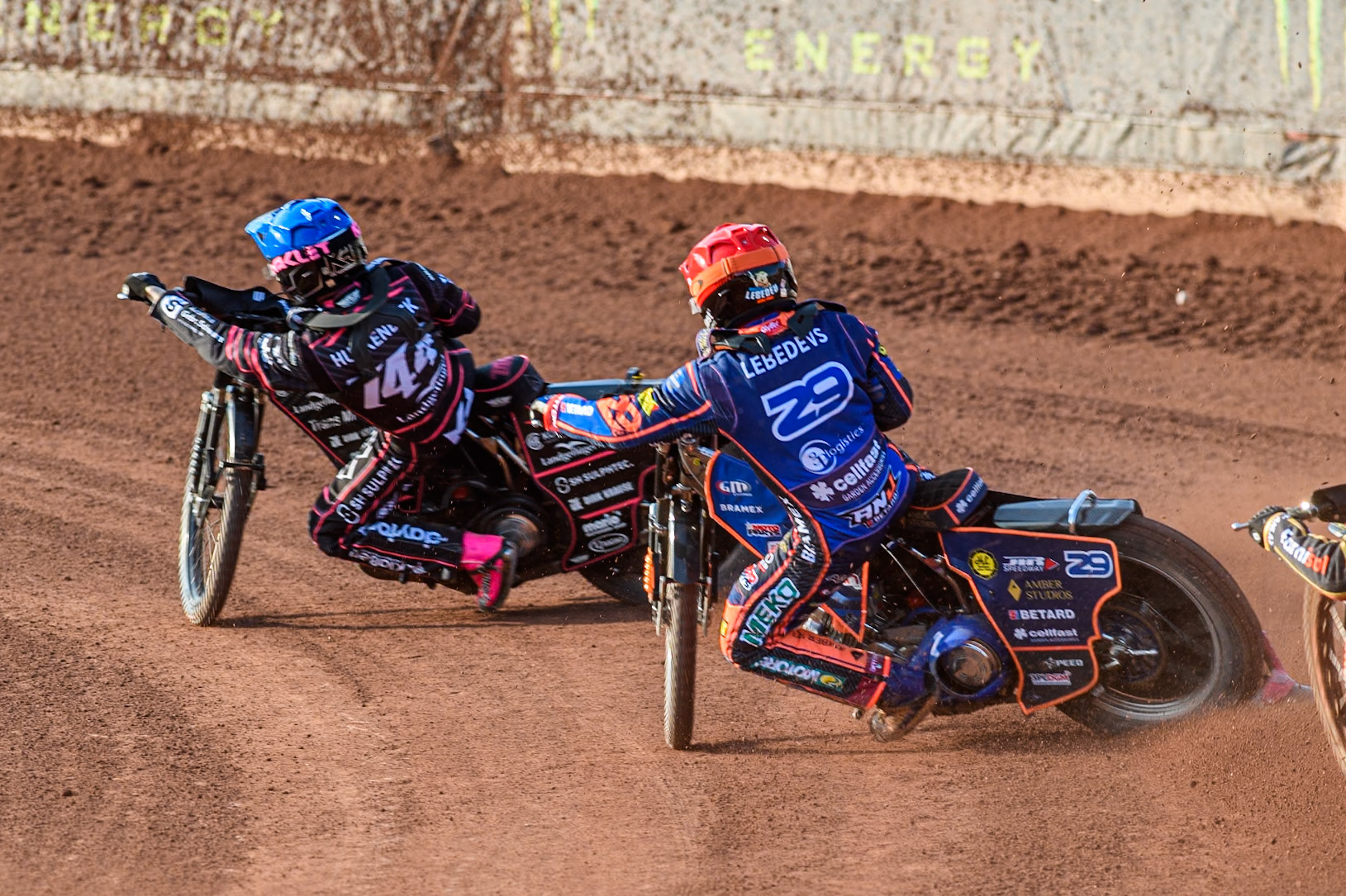Andzejs Lebedevs (29) of Latvia in Red chases Kai Huckenbeck (744) of Germany in Blue during the ATPI FIM Speedway Grand Prix Round 5 at the National Speedway Stadium, Manchester, on Saturday 14th June 2025. (Photo: Ian Charles | MI News)