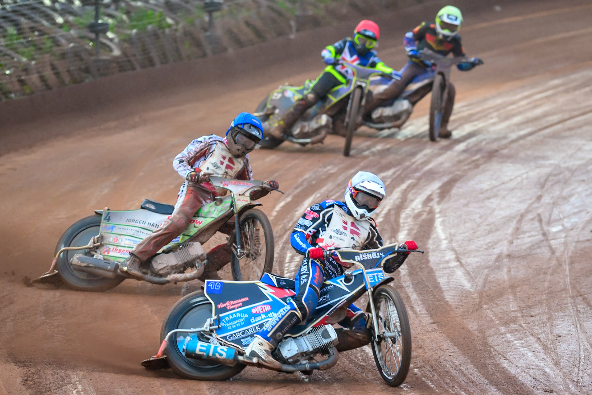 Frederik Jacobsen of Denmark in White Jonas Knudsen of Denmark in Blue Reserve Tom Brennan of Great Britain in Red and Mario Hausl of Germany in Yellow during the Speedway GP Qualifying Round 3 at Allied Ashfield Stadium, Glasgow on Saturday 30th May 2026. (Photo: Ian Charles | MI News)