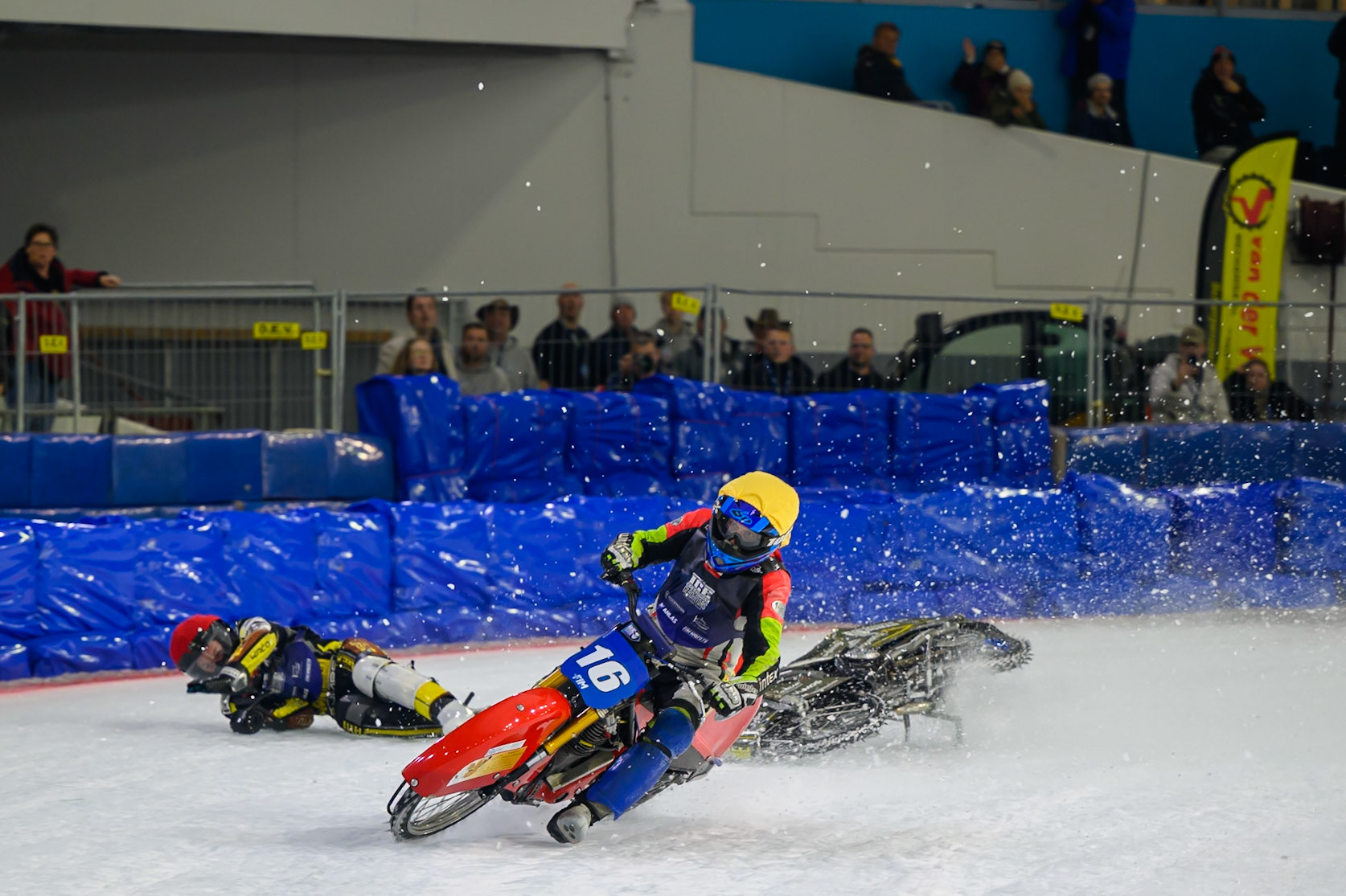 Heikki Huusko (67) of Finland  collides with Wild Card Harald Simon (16) of Austria in Yellow in the first turn during the FIM Ice Speedway Gladiators World Championship Final 3 at Ice Rink Thialf, Heerenveen on Saturday 11th April 2026. (Photo: Ian Charles | MI News)