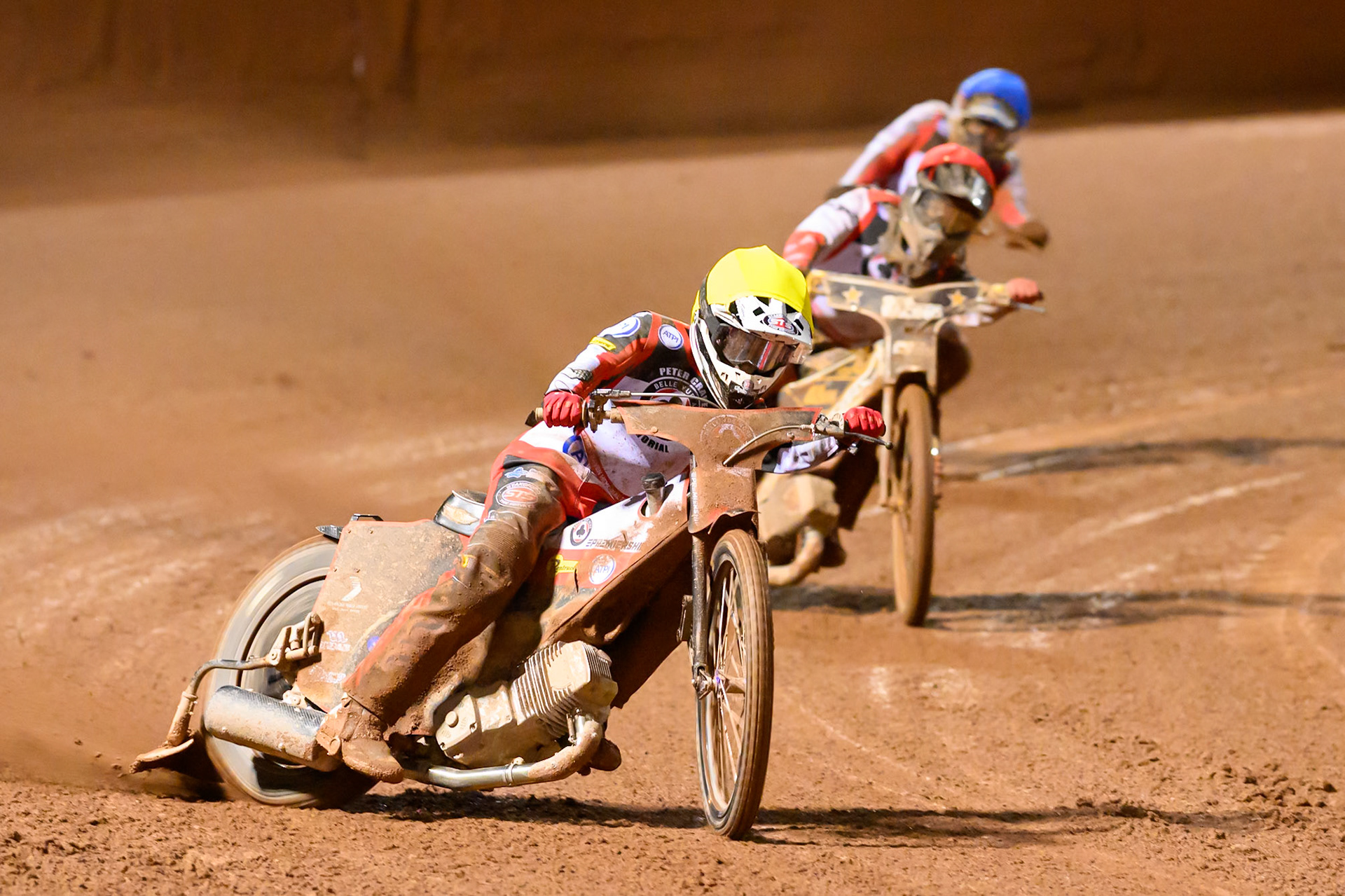 Zach Cook in Yellow leading Norick Blodorn  in Red and Rasmus Jensen in Blue during the Peter Craven Memorial Trophy at the National Speedway Stadium, Manchester, on Monday 16th March 2026. (Photo: Ian Charles | MI News)