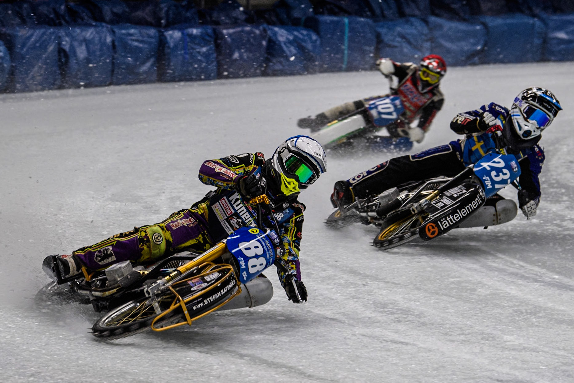 Germany's Max Niedermaier (88) (White) leads  Sweden's Jimmy Hörnell Lidfalk (237)(Blue)  and Czech Republic's Andrej Diviš (107) (Red) during the FIM Ice Speedway Gladiators World Championship Final 1 at the Max-Aicher-Arena, Inzell on Saturday 23 March 2024. (Photo: Ian Charles | MI News)
