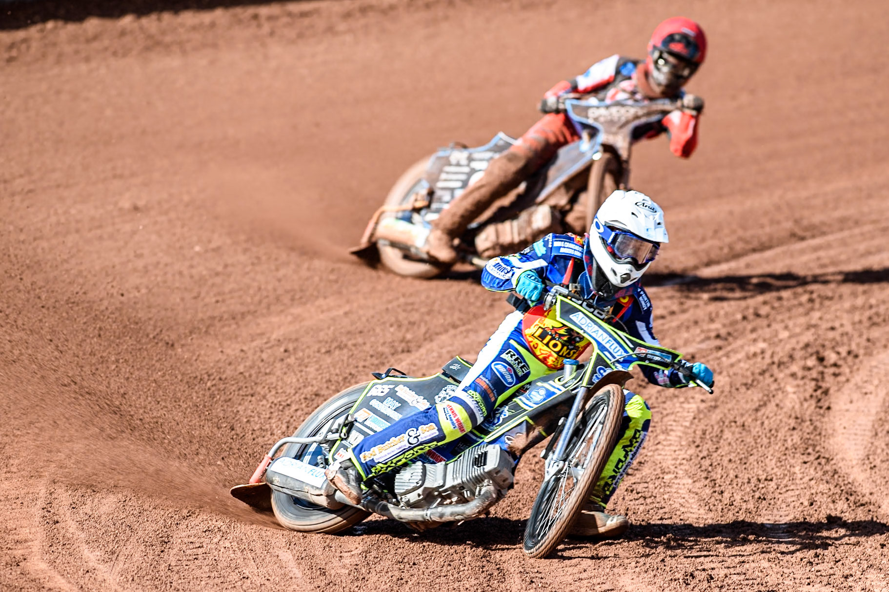 Leicester Lion Cubs' Jody Scott (White) leads  Belle Vue Colts' Freddy Hodder (Red) during the WSRA  National Development League match between Belle Vue Colts and Leicester Lion Cubs at the National Speedway Stadium, Manchester on Friday 29th March 2024. (Photo: Ian Charles | MI News)