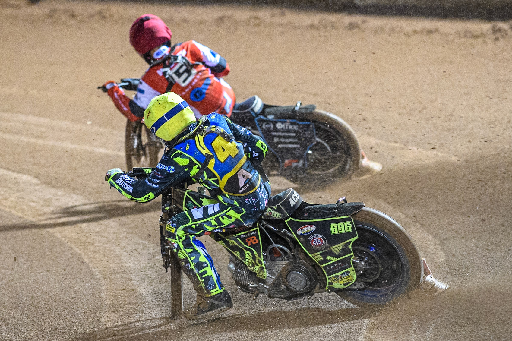 Sheffield Cubs' Ace Pijper in Yellow chases Belle Vue Colts' Freddy Hodder in Red during the WSRA National Development League match between Belle Vue Colts and Sheffield Tiger Cubs at the National Speedway Stadium, Manchester on Monday 7th October 2024. (Photo: Ian Charles | MI News)