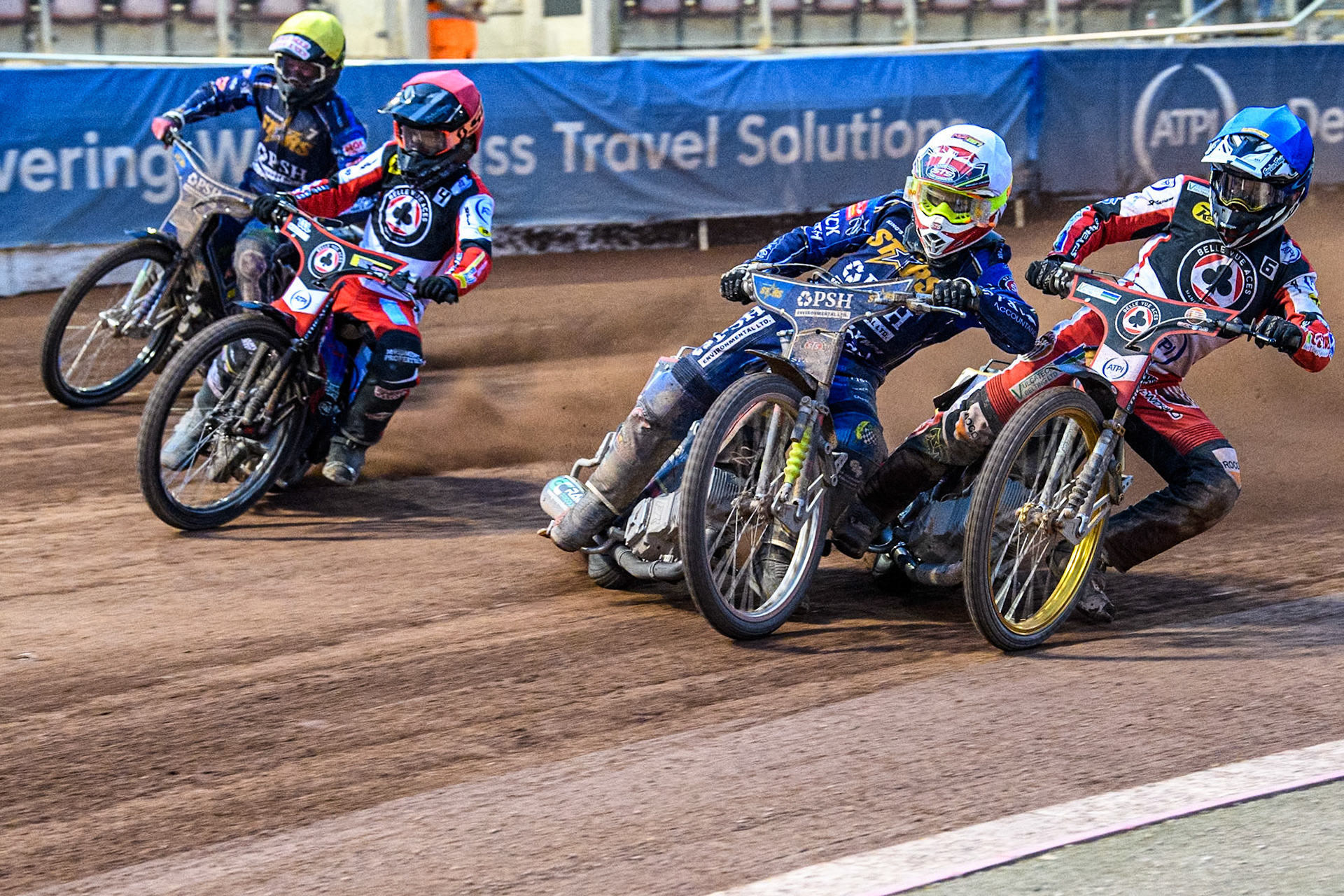 King Lynn Stars' Michael Palm Toft in White leading Belle Vue Aces' Connor Mountain in Blue, Belle Vue Aces' Ben Cook in Red and King Lynn Stars' Anders Rowe in Yellow during the Rowe Motor Oil Premiership match between Belle Vue Aces and King's Lynn Stars at the National Speedway Stadium, Manchester on Monday 20th May 2024. (Photo: Ian Charles | MI News)
