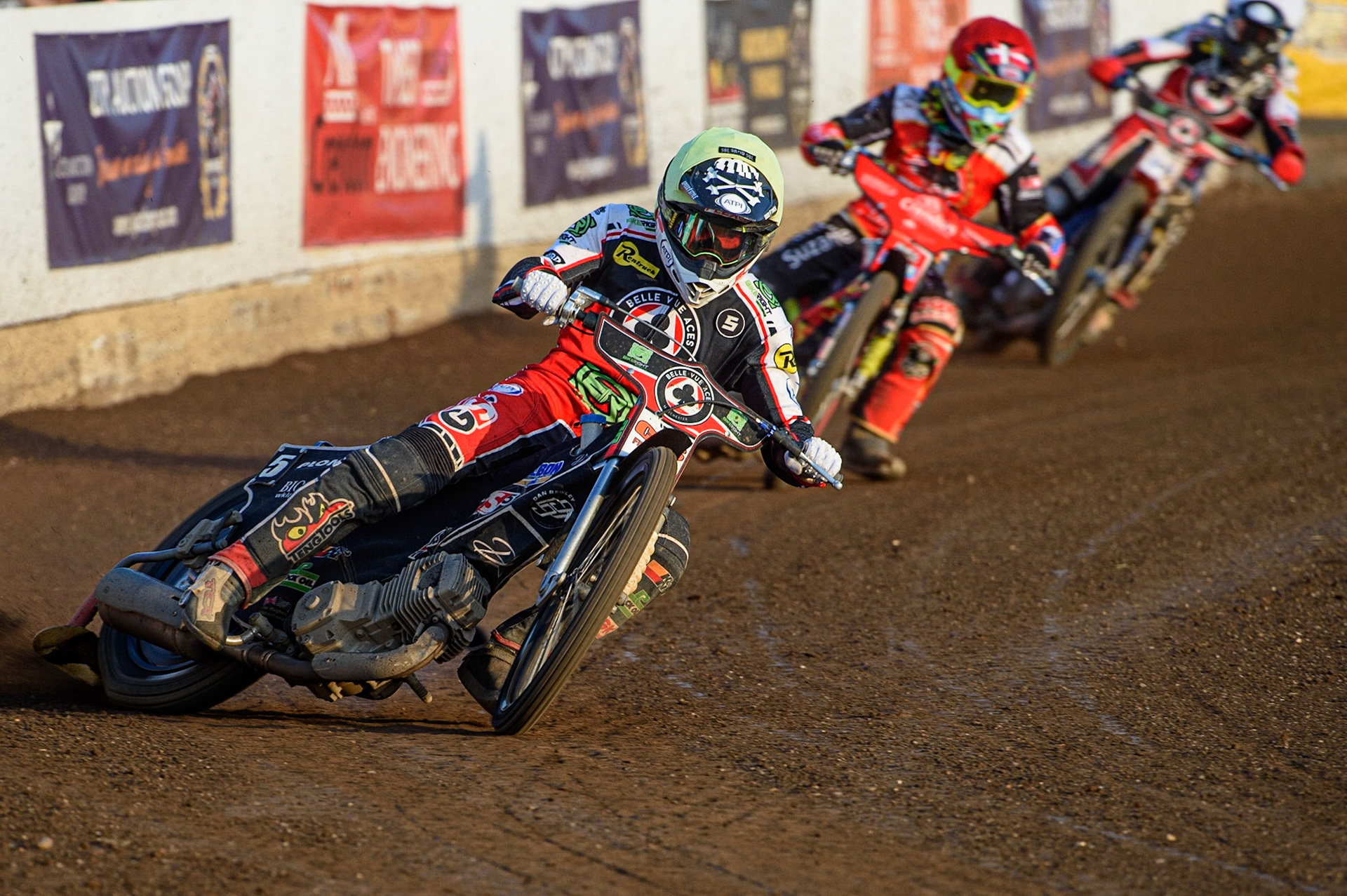 PETERBOROUGH, UK. JULY 19TH   Dan Bewley  (Yellow) on his way to breaking the Peterborough track record as he leads Michael Palm-Toft  (Red) and Brady Kurtz  (White) during the SGB Premiership match between Peterborough and Belle Vue Aces at East of England Showground, Peterborough on Monday 19th July 2021. (Credit: Ian Charles | MI News)