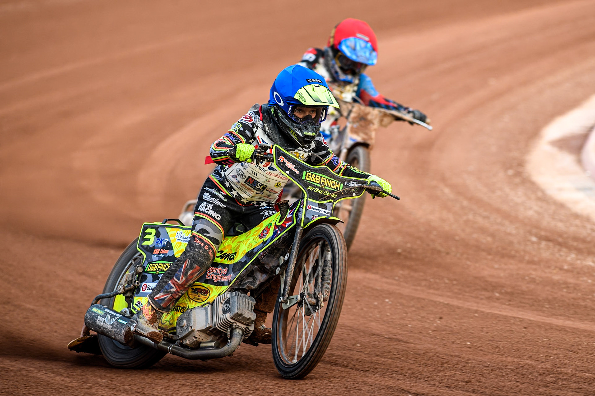 Archie Rolph (250cc) in Blue leading Ollie Binns (250cc) in Red during the British Youth 250cc Championships at the National Speedway Stadium, Manchester on Friday 30th August 2024. (Photo: Ian Charles | MI News)