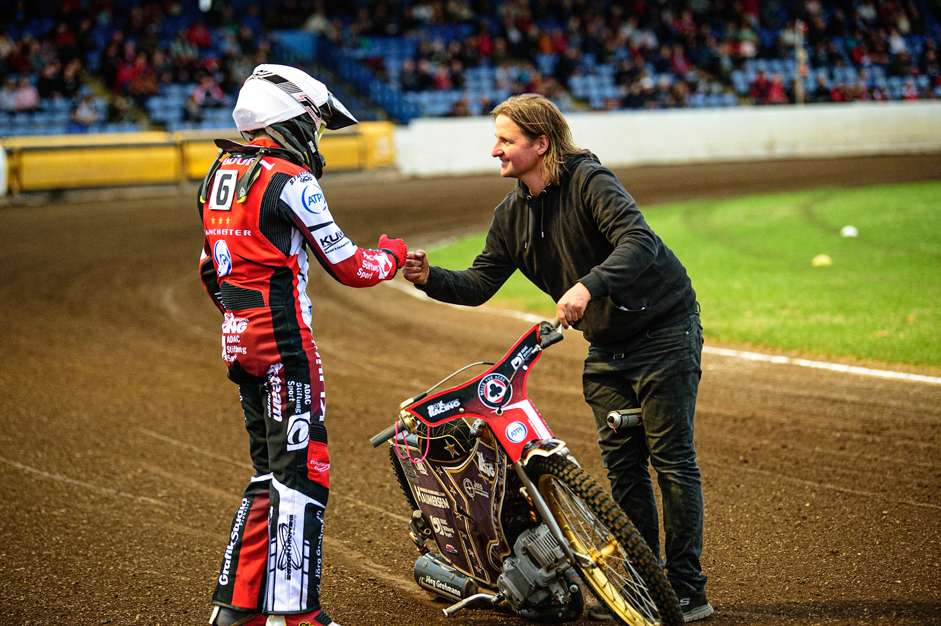 PETERBOROUGH, UK. MAY 9TH  Norick Blödorn (left) is congratulated by his mechanic Robbie Kessler, on his first heat win for Belle Vue ATPI Aces  during the SGB Premiership match between Peterborough Panthers and Belle Vue Aces at East of England Showground, Peterborough on Monday 9th May 2022. (Credit: Ian Charles | MI News)
