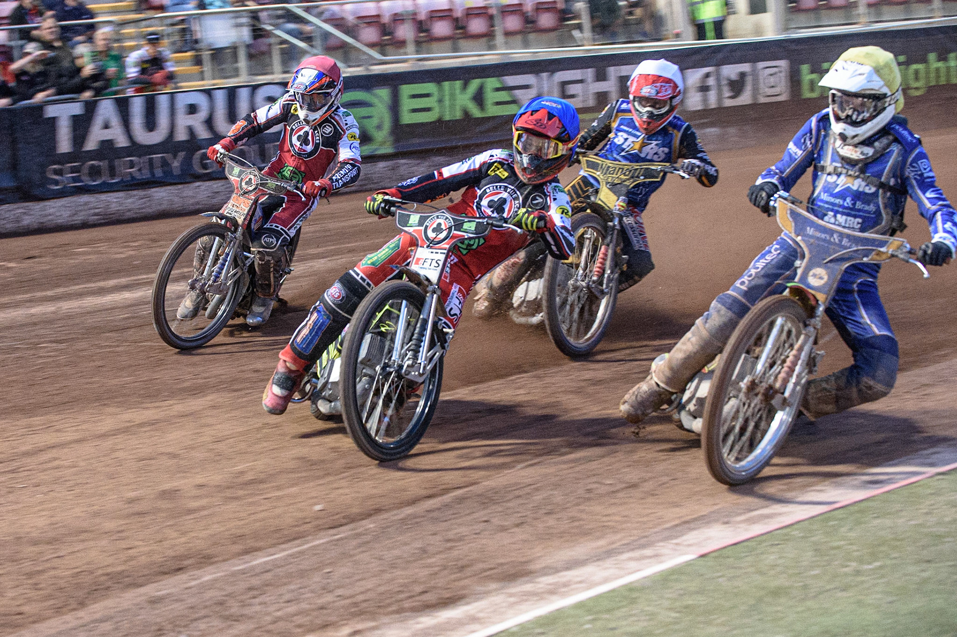 MANCHESTER, UK. AUGUST 23RD    Jye Etheridge  (Blue) leads Kasper Andersen  (Yellow) Ben Barker  (White) and Steve Worrall  (Red) into the  turn during the SGB Premiership match between Belle Vue Aces and King's Lynn Stars at the National Speedway Stadium, Manchester on Monday 23rd August 2021. (Credit: Ian Charles | MI News)