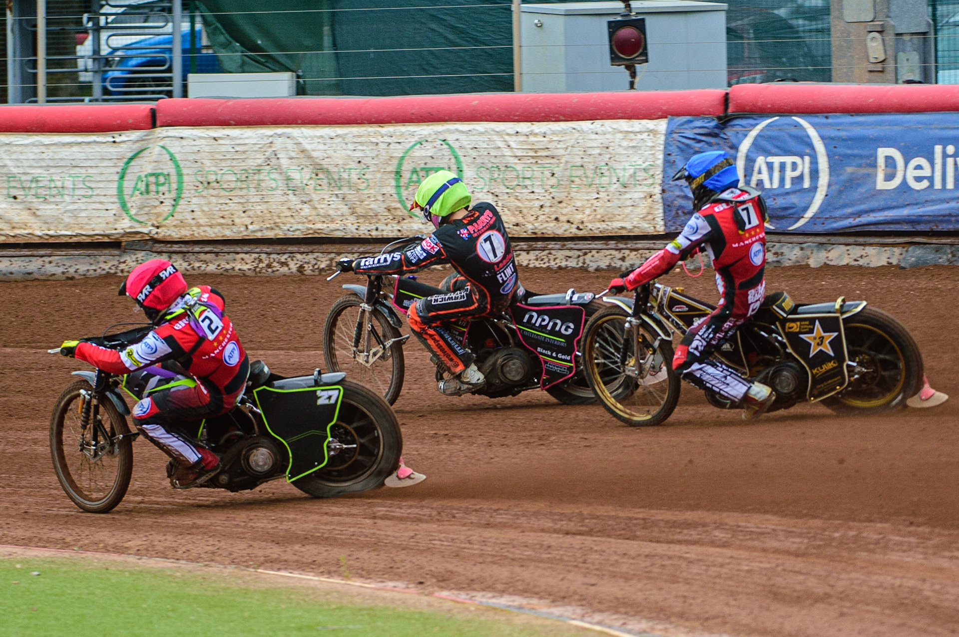 Tom Brennan  (Red) passes Leon Flint  (Yellow) on the inside with Norick Blödorn  (Blue) behind during the SGB Premiership match between Belle Vue Aces and Wolverhampton Wolves at the National Speedway Stadium, Manchester on Monday 29th August 2022. (Credit: Ian Charles | MI News)