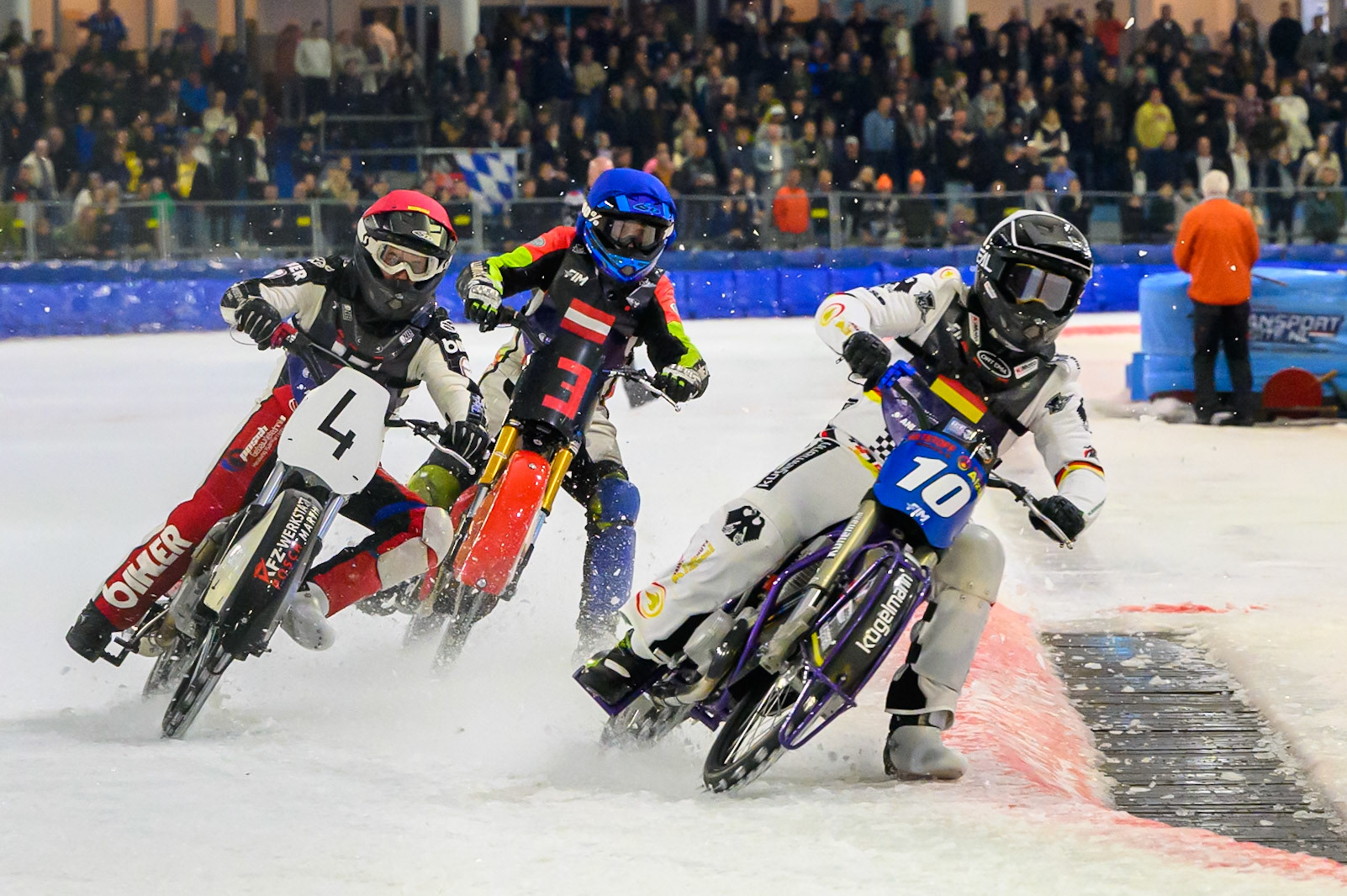 Austria v Germany: Christoph Kirchner (10) of Germany leading Martin Posch (4) of Austria  in Red and Harald Simon (3) of Austria   in Blue during the FIM Ice Speedway Of Nations at Ice Rink Thialf, Heerenveen on Sunday 12th April 2026. (Photo: Ian Charles | MI News)