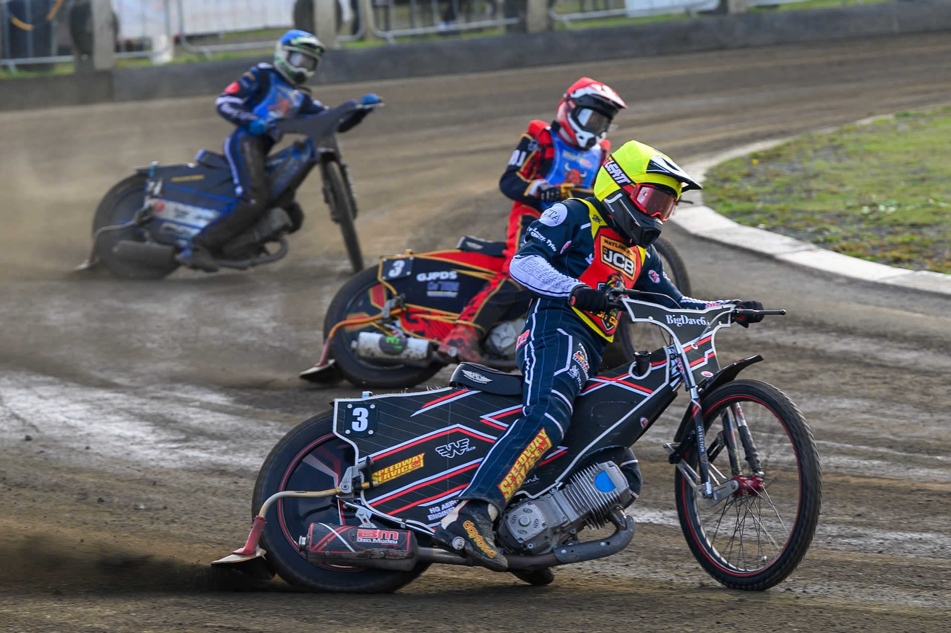 Ben Morley of Leicester Lion Cubs  in Yellow leading Luke Harris of Buxton Bulls   in Red  and Charlie Southwick, Guest Rider for Buxton Bulls   in Blue during the WSRA National Development League match between Buxton Bulls and Leicester Lion Cubs at Hi-Edge Speedway, Buxton on Sunday 4th October 2026. (Photo: Ian Charles | MI News)