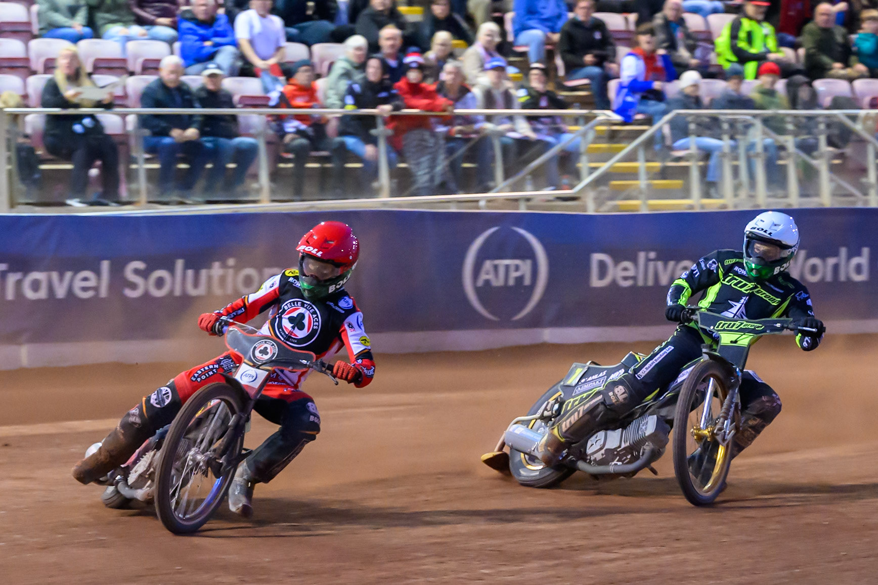 Brady Kurtz of Belle Vue Aces  in Red leading Jason Doyle of Ipswich Witches  in White during the Rowe Motor Oil Premiership match between Belle Vue Aces and Ipswich Witches at the National Speedway Stadium, Manchester on Monday 4th August 2025. (Photo: Ian Charles | MI News)