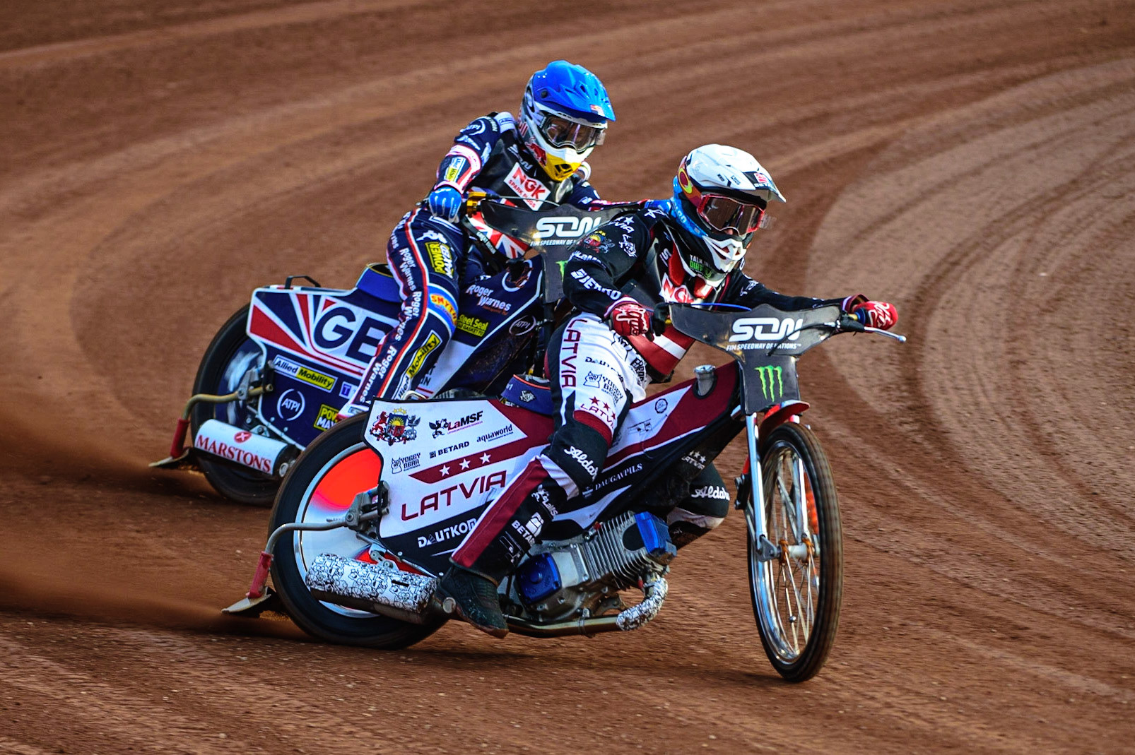 MANCHESTER, UK. OCT 16TH Andzejs Lebedevs of Latvia (White) leads Robert Lambert of Great Britain (Blue) during the Monster Energy FIM Speedway of Nations at the National Speedway Stadium, Manchester on Saturday  16th October 2021. (Credit: Ian Charles | MI News)