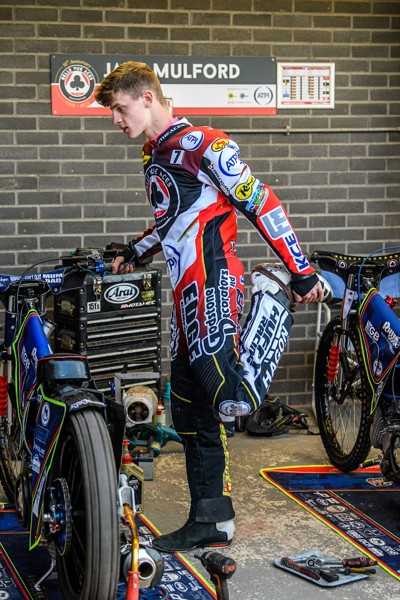 Jake Mulford warms his bike up whilst doing some stretches during the Sports Insure Premiership match between Belle Vue Aces and Wolverhampton Wolves at the National Speedway Stadium, Manchester on Monday 29th May 2023. (Photo: Ian Charles | MI News)
