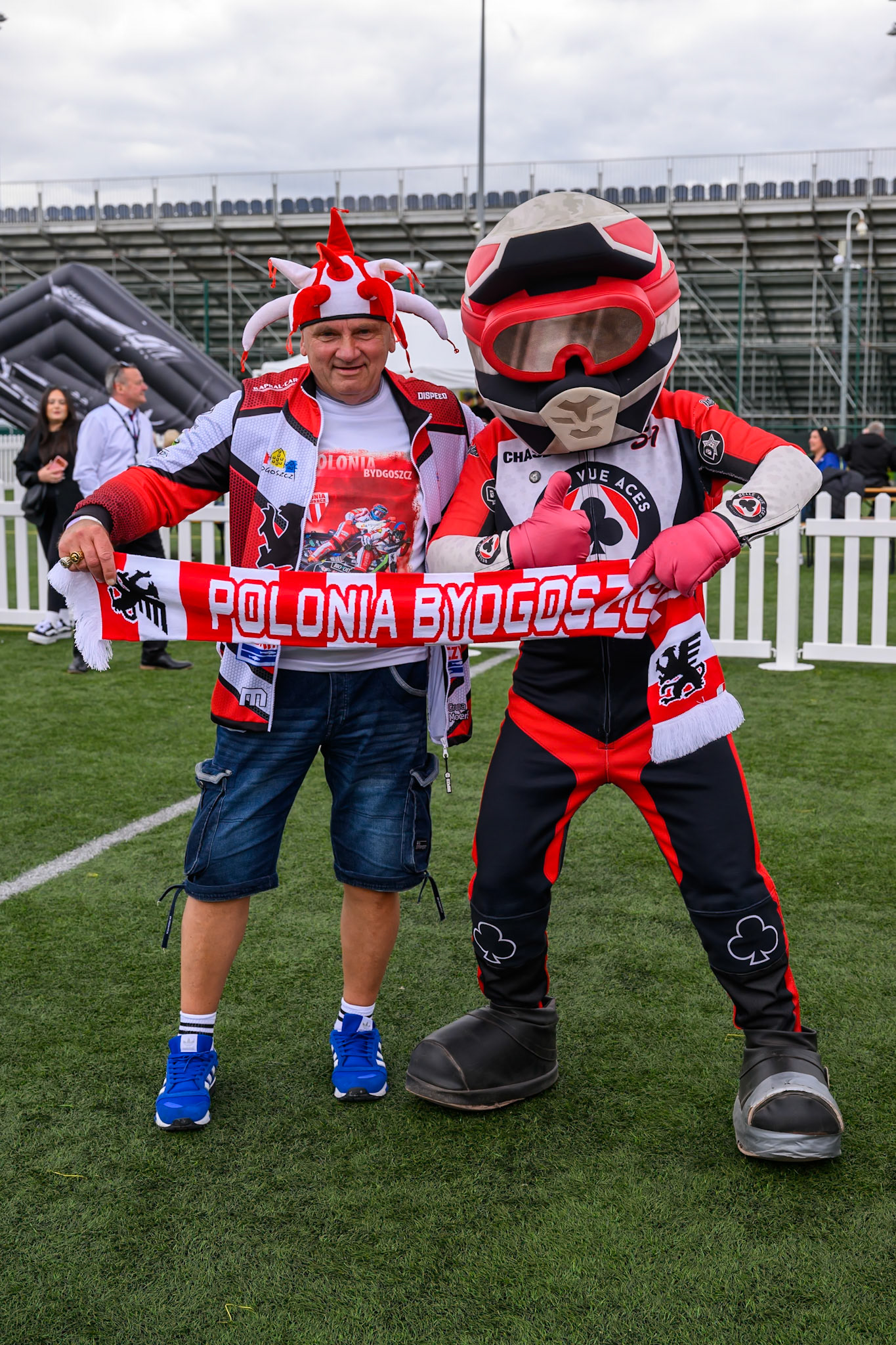 Polish fan with Belle Vue Mascot Chase the Ace during the ATPI  FIM Speedway GP of Manchester at the National Speedway Stadium, Manchester on Saturday 6th June 2026. (Photo: Ian Charles | MI News)