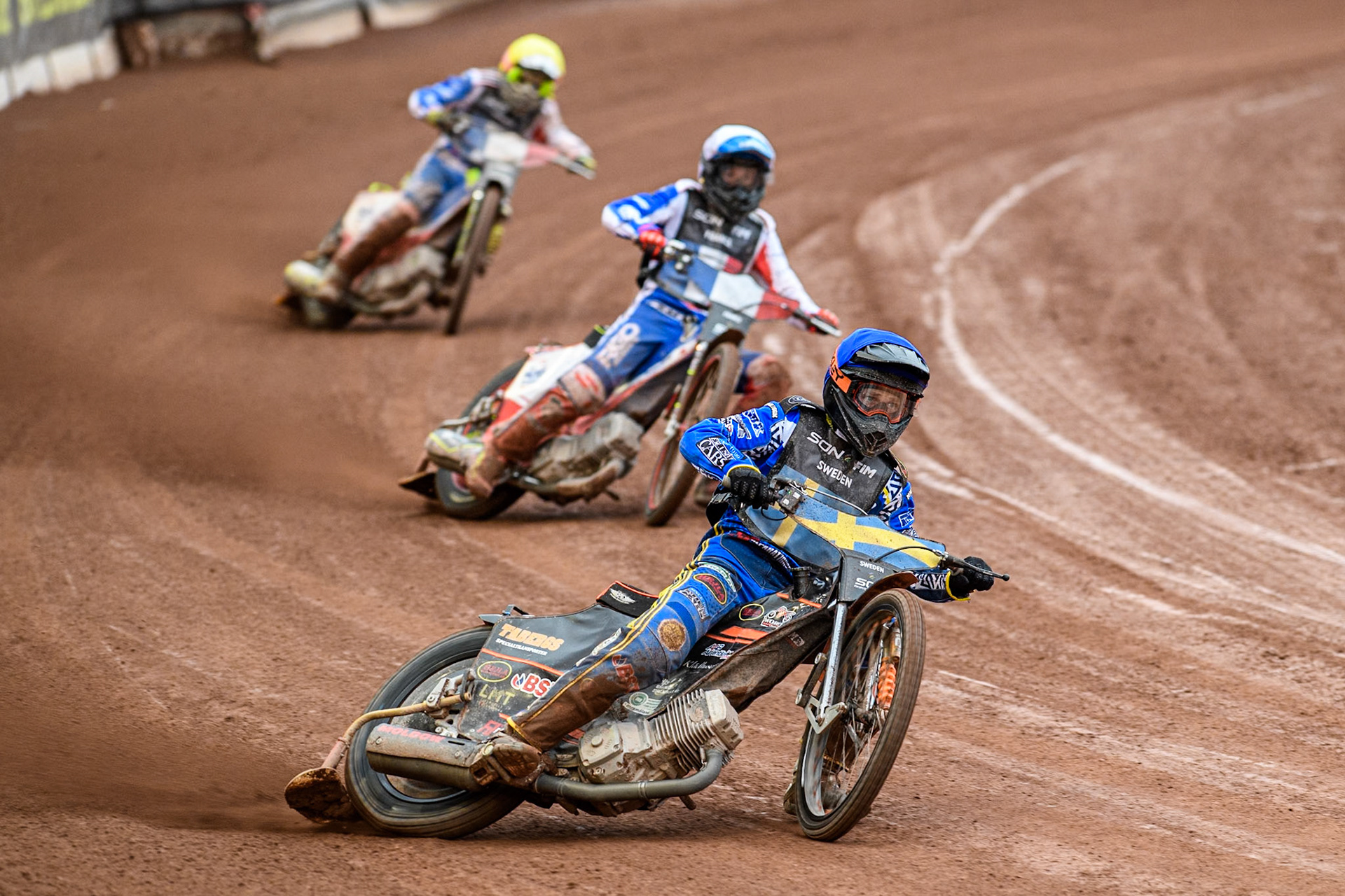 Sweden v France: Jacob Thorssell of Sweden in Blue leading David Bellego of France in White and Steven Goret of France in Yellow during the Monster Energy FIM Speedway of Nations Semi-Final 1 at the National Speedway Stadium, Manchester on Tuesday 9th July 2024. (Photo: Ian Charles | MI News)
