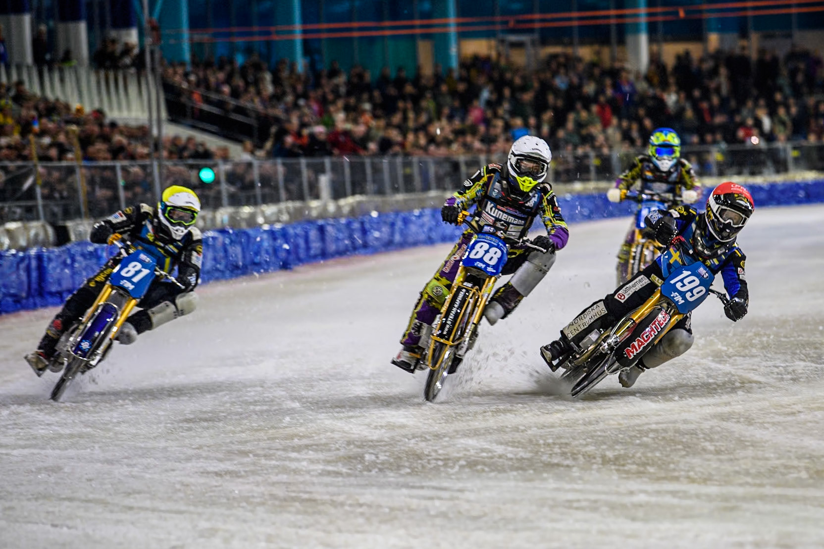 Sweden's Martin Haarahiltunen (199)  in Red rides inside Germany's Max Niedermaier (88) in White and \Sweden"s Jimmy Olsén (81) in Yellow with Germany's Maximillian Neidermaier (16) in Blue behind during the FIM Ice Speedway Gladiators World Championship Final 4 at Ice Rink Thialf, Heerenveen on Sunday 7th April 2024. (Photo: Ian Charles | MI News)