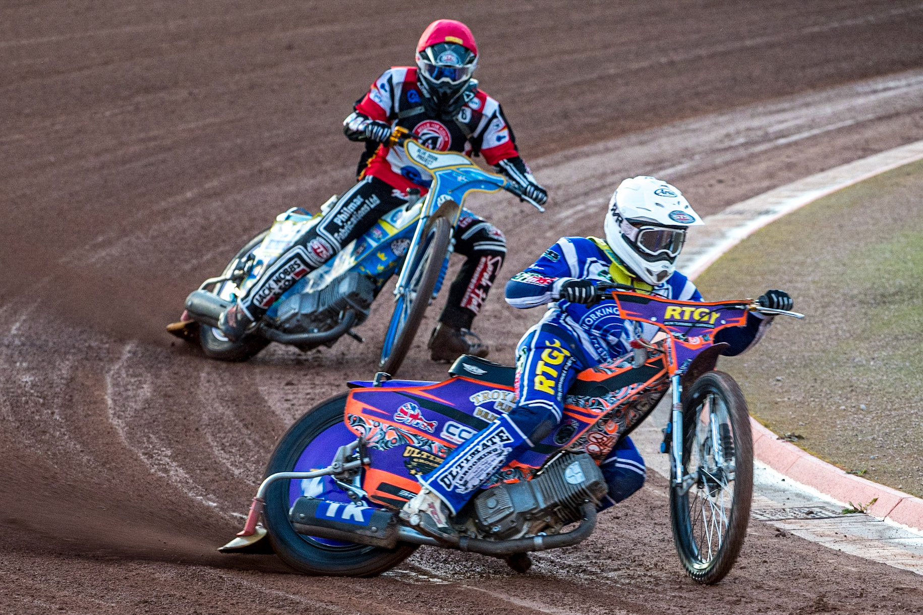Elliot Kelly (White) leads  Jack Shimelt (Red) during the National Development League match between Belle Vue Colts and Workington Comets at the National Speedway Stadium, Manchester on Friday 25th August 2023. (Photo: Ian Charles | MI News)